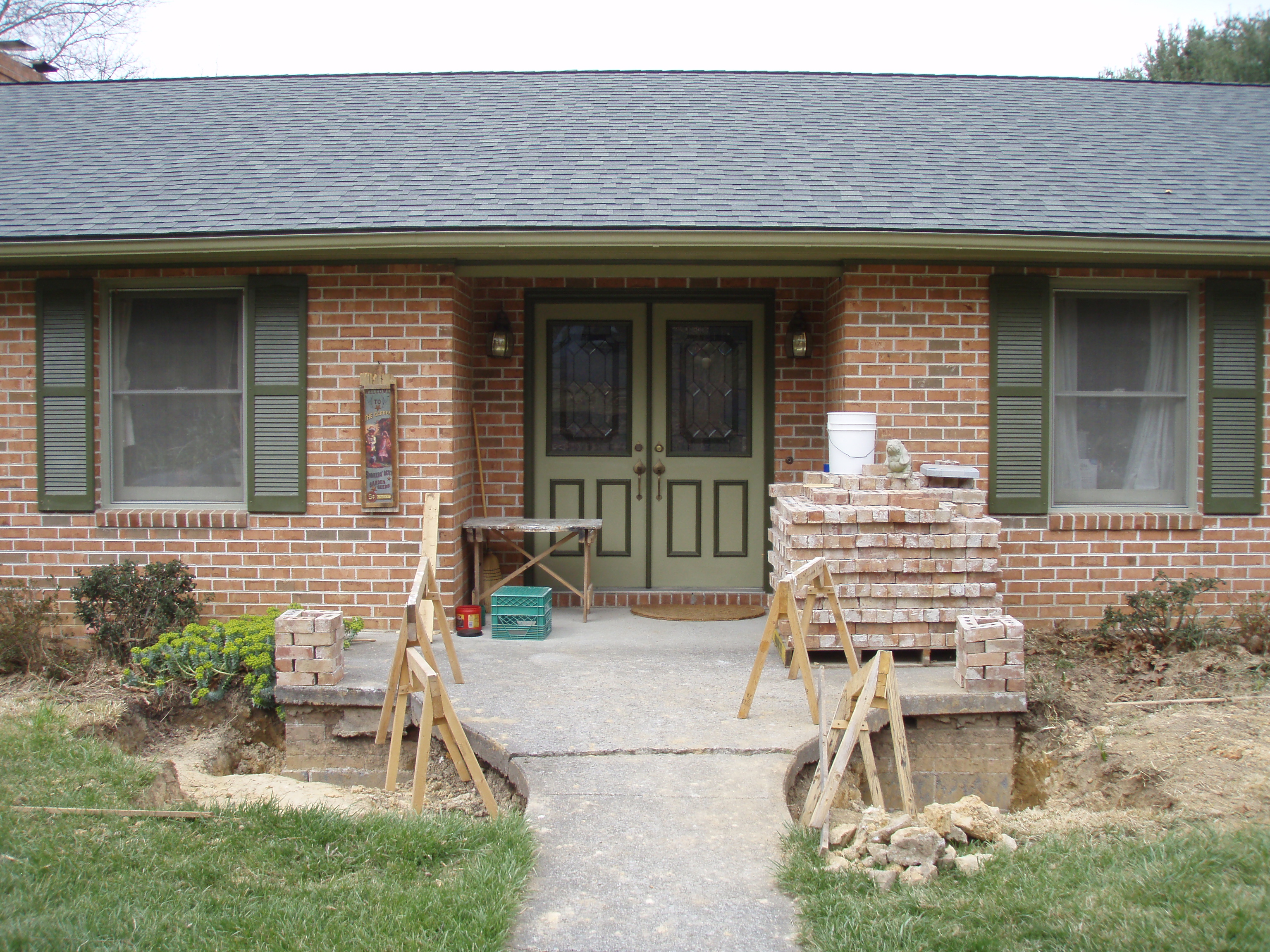 front gable porch with brick raised garden