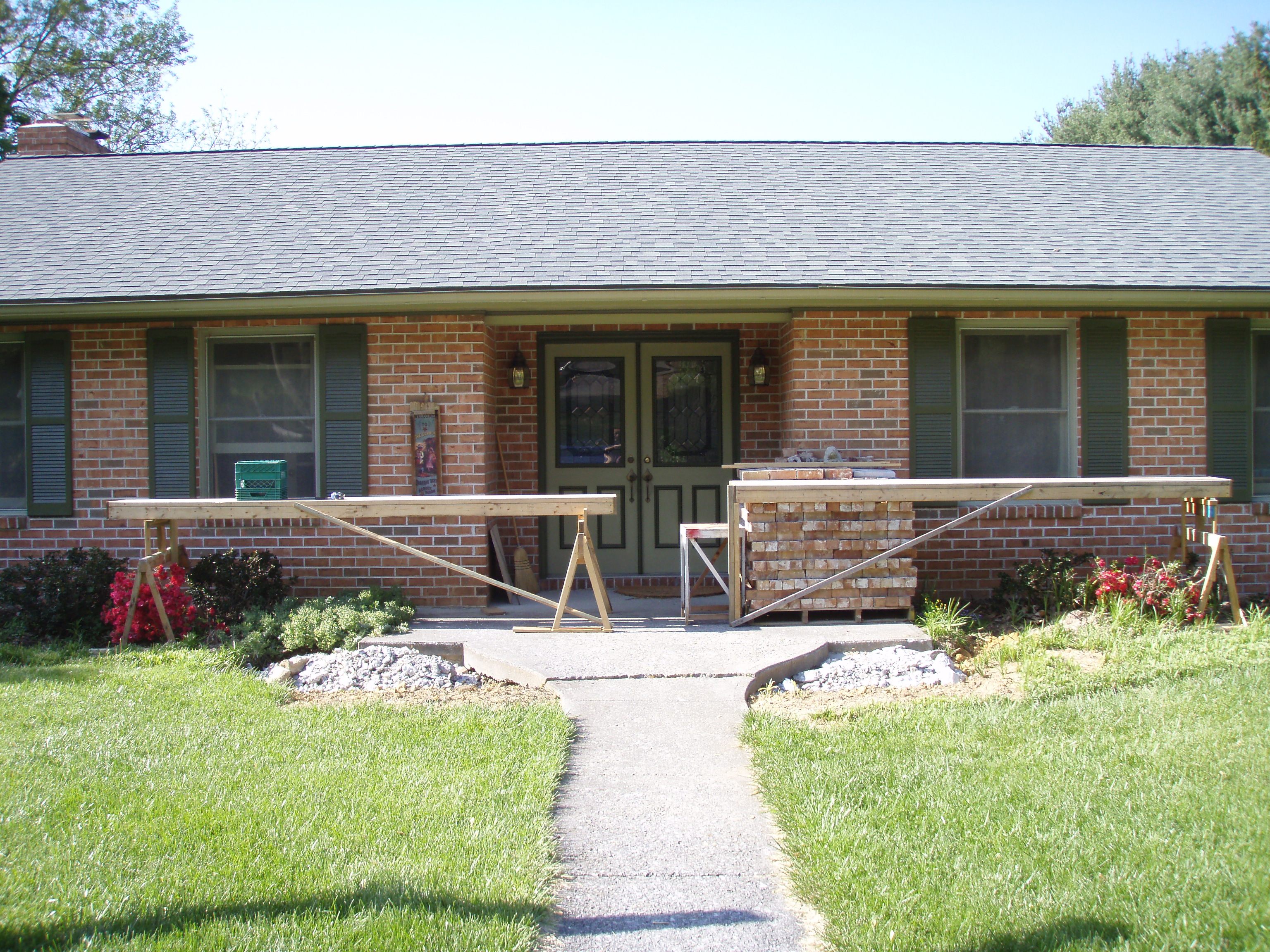 front gable porch with brick raised garden