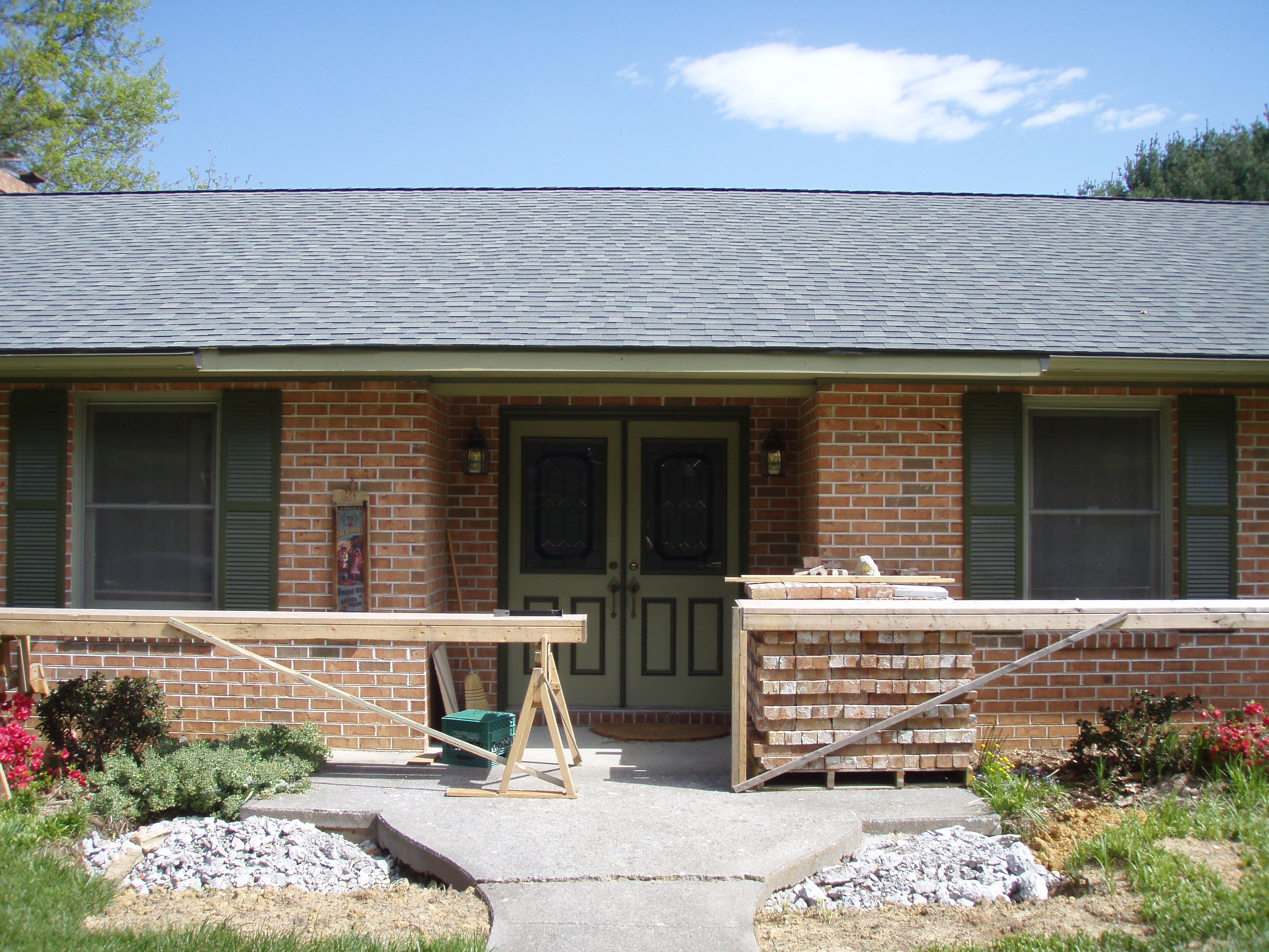 front gable porch with brick raised garden