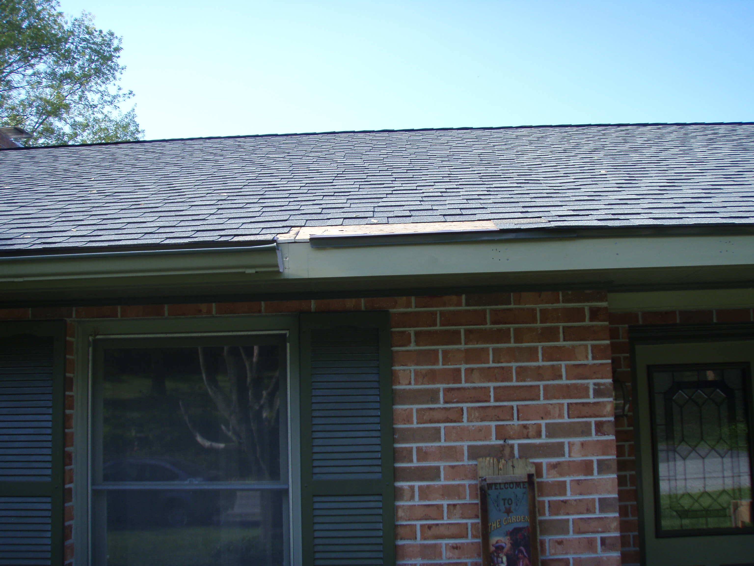 front gable porch with brick raised garden