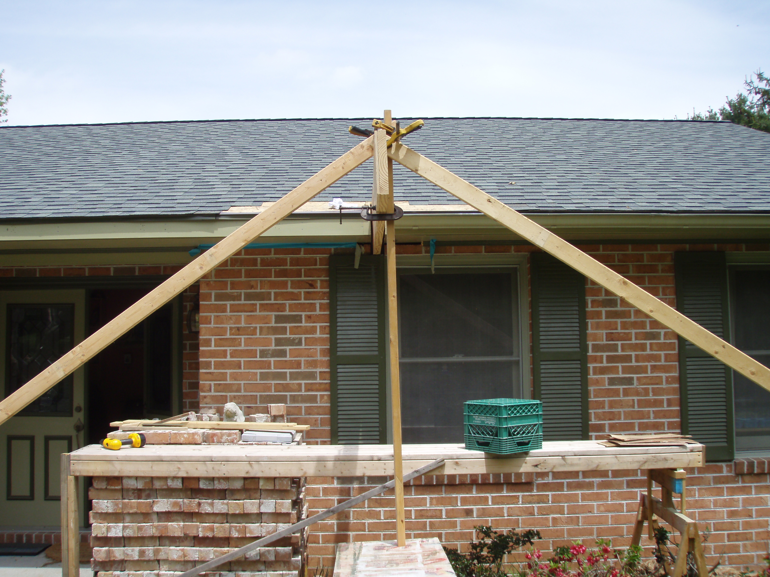 front gable porch with brick raised garden