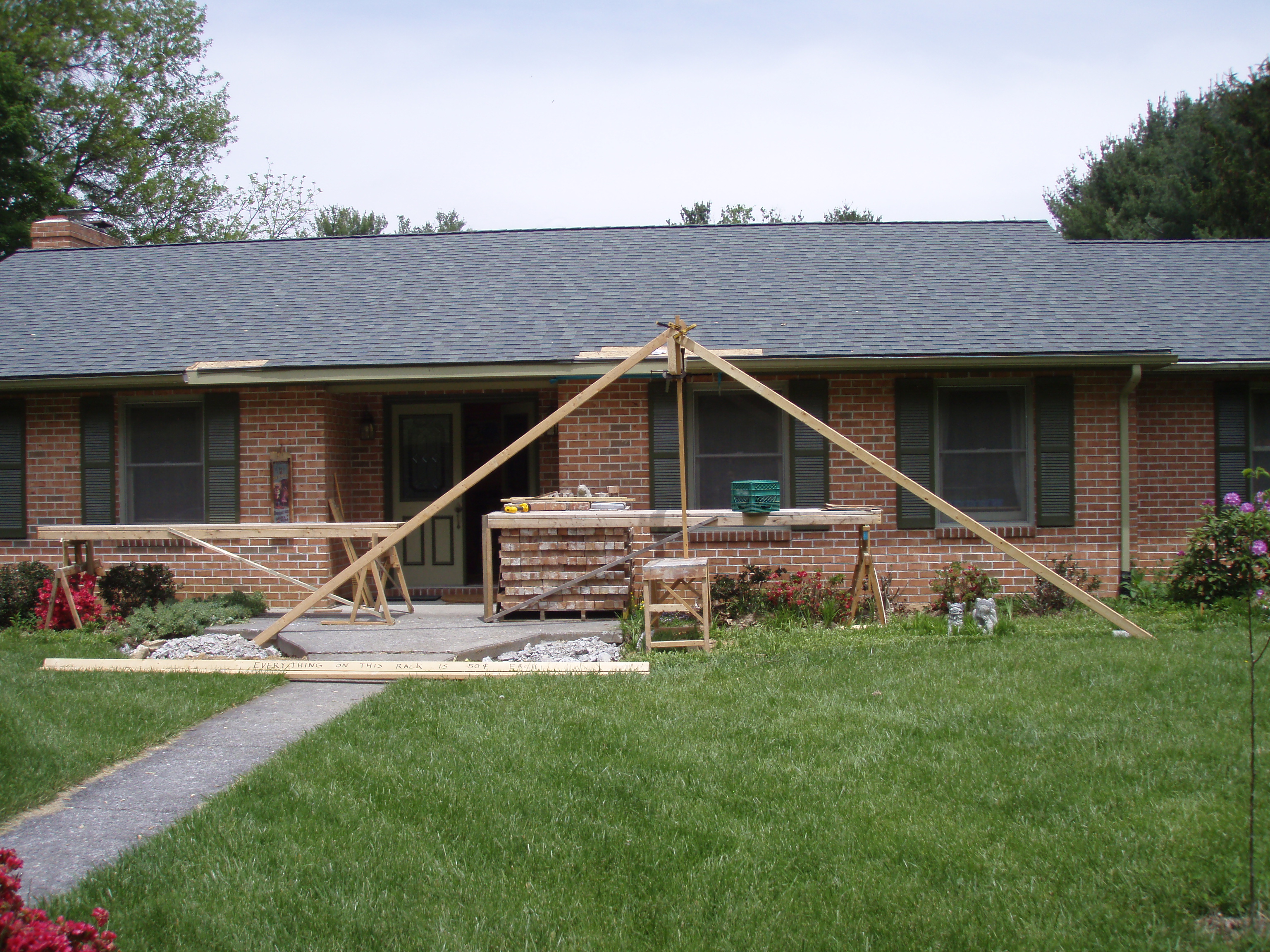 front gable porch with brick raised garden