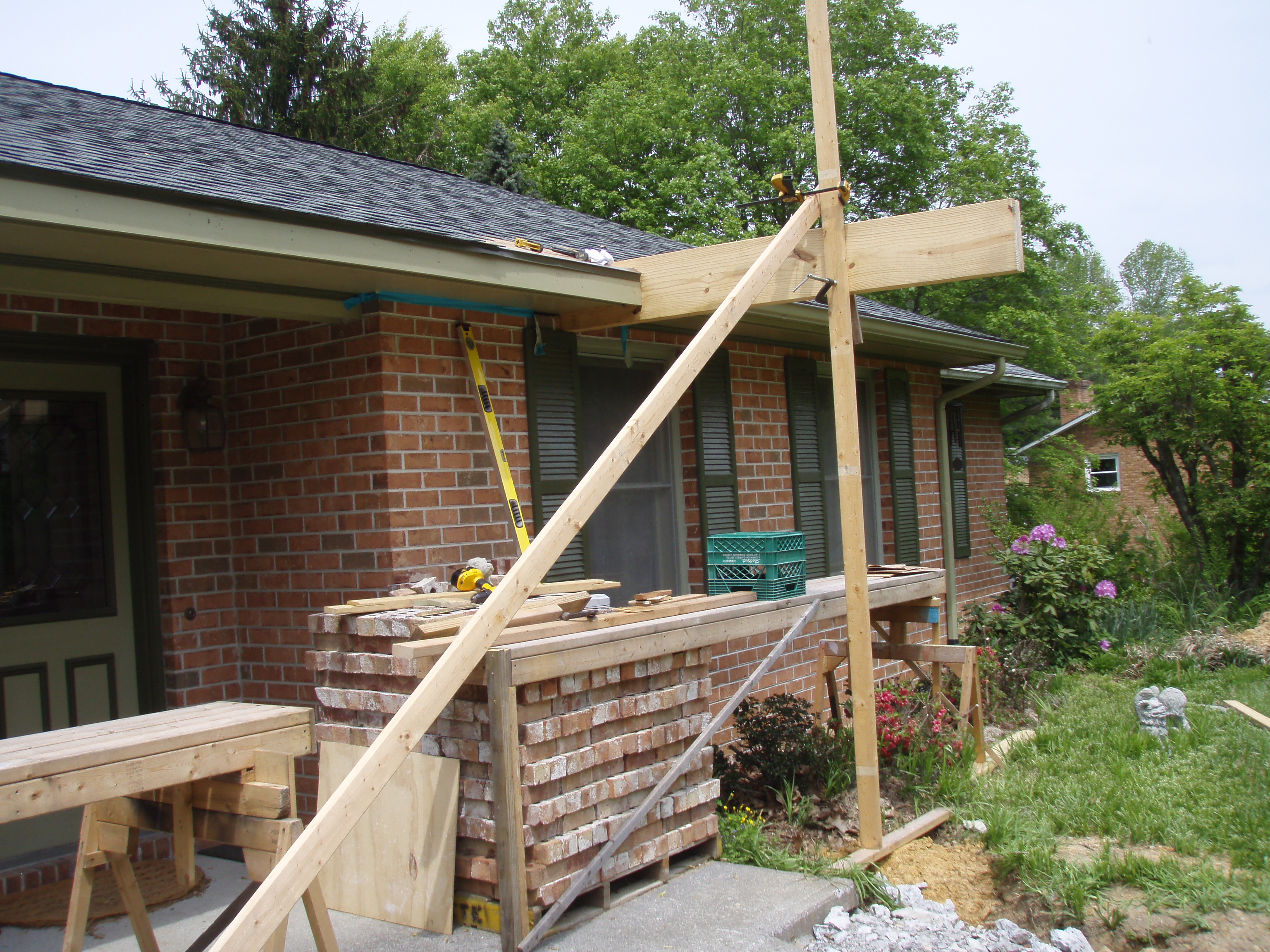 front gable porch with brick raised garden