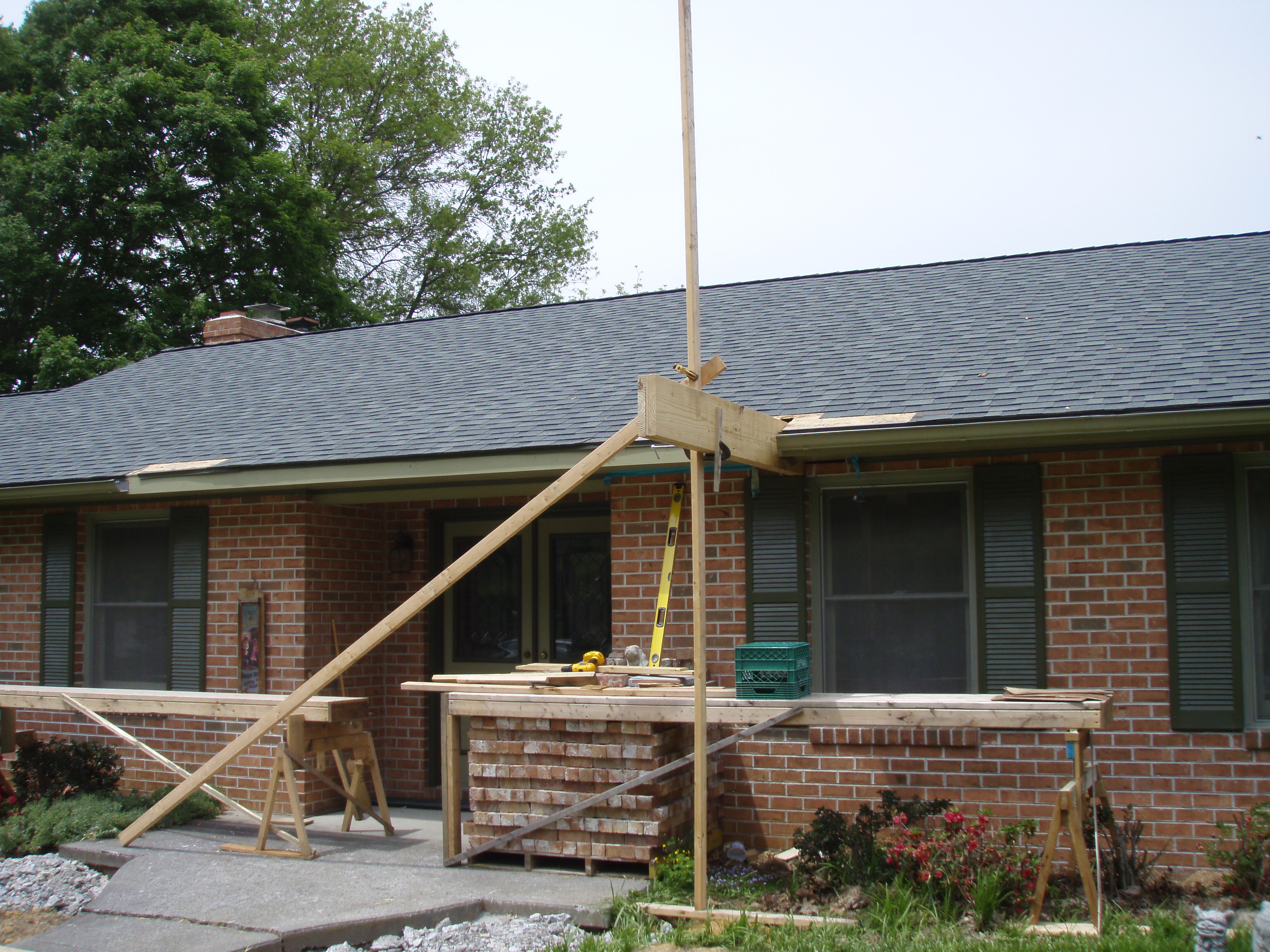 front gable porch with brick raised garden