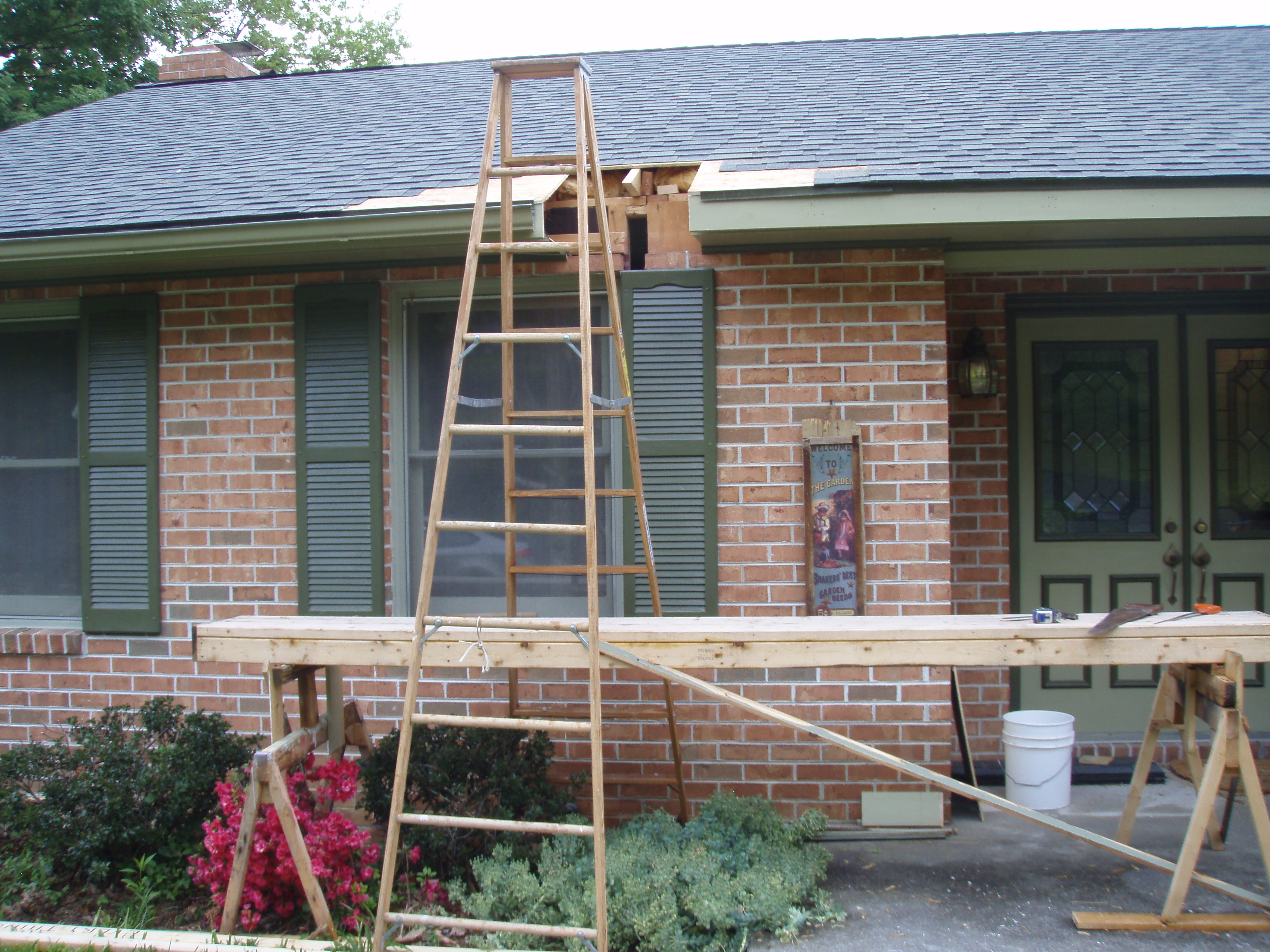 front gable porch with brick raised garden