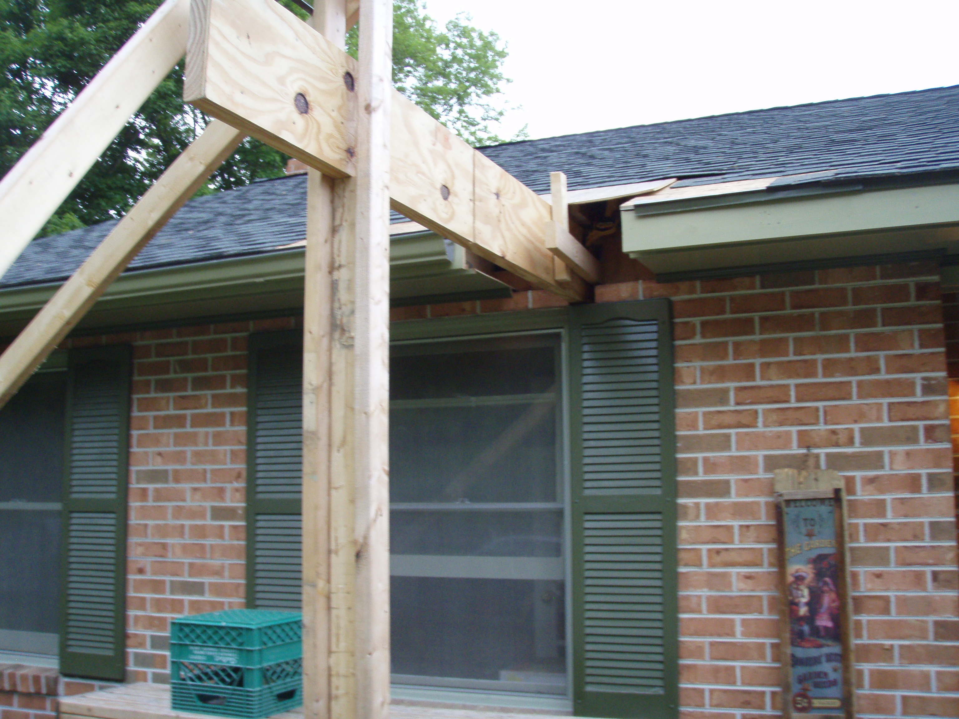 front gable porch with brick raised garden