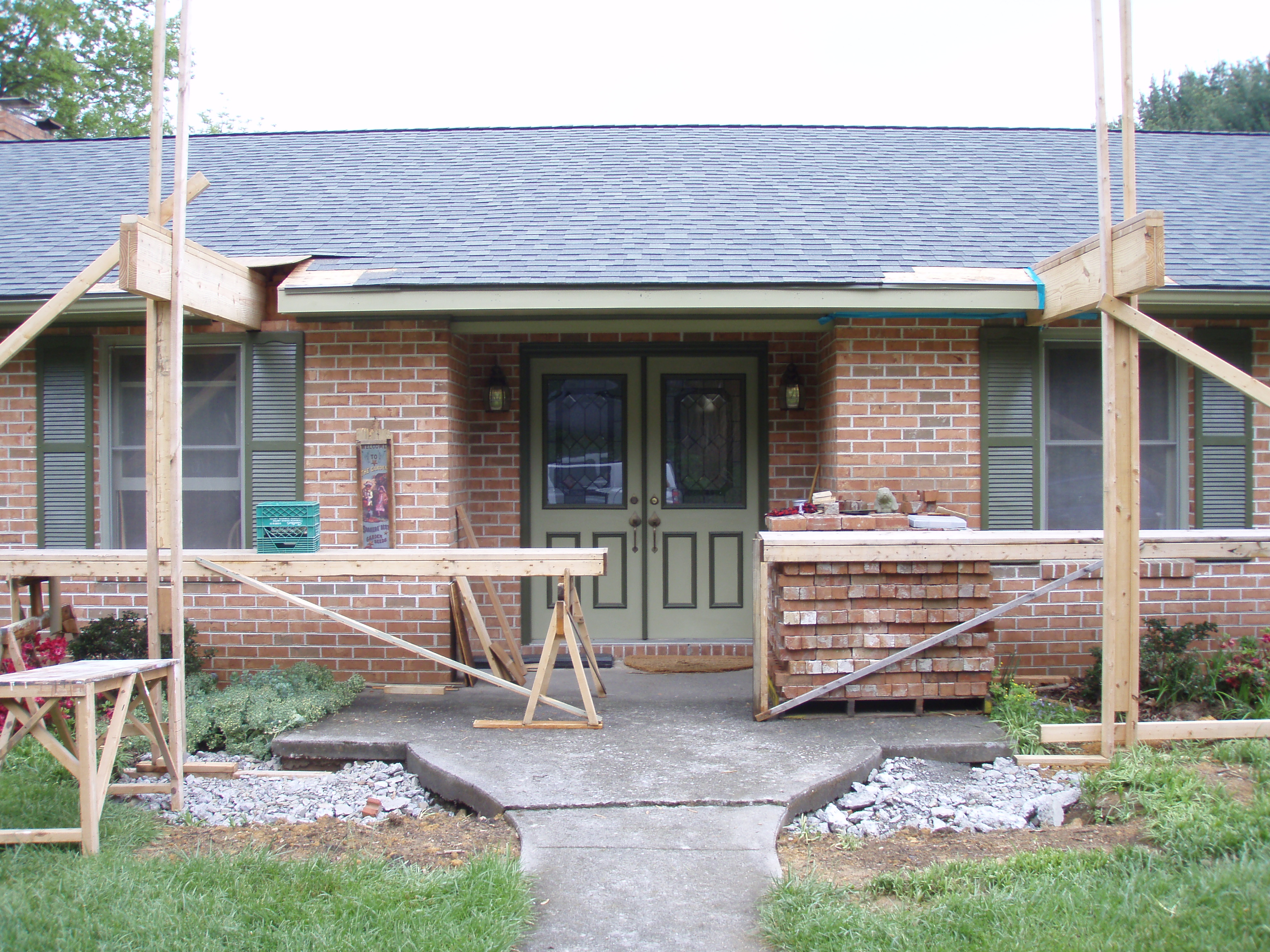 front gable porch with brick raised garden