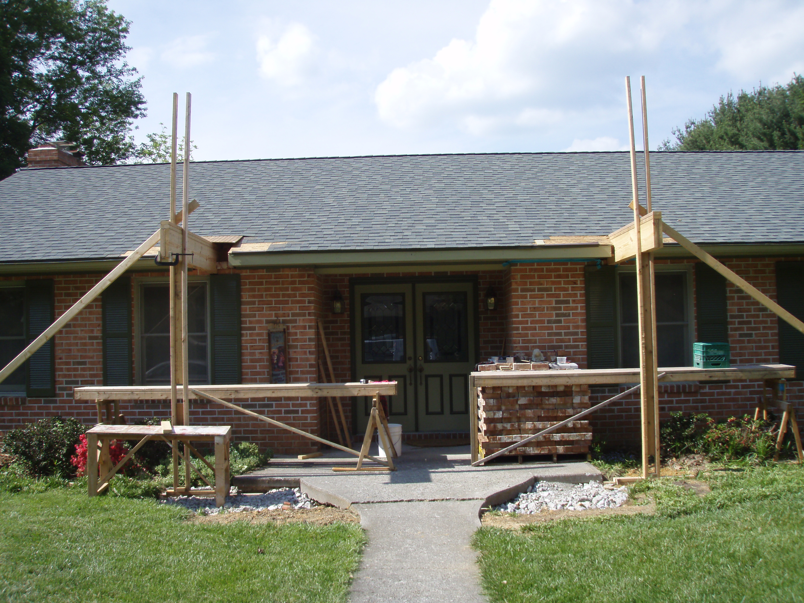 front gable porch with brick raised garden