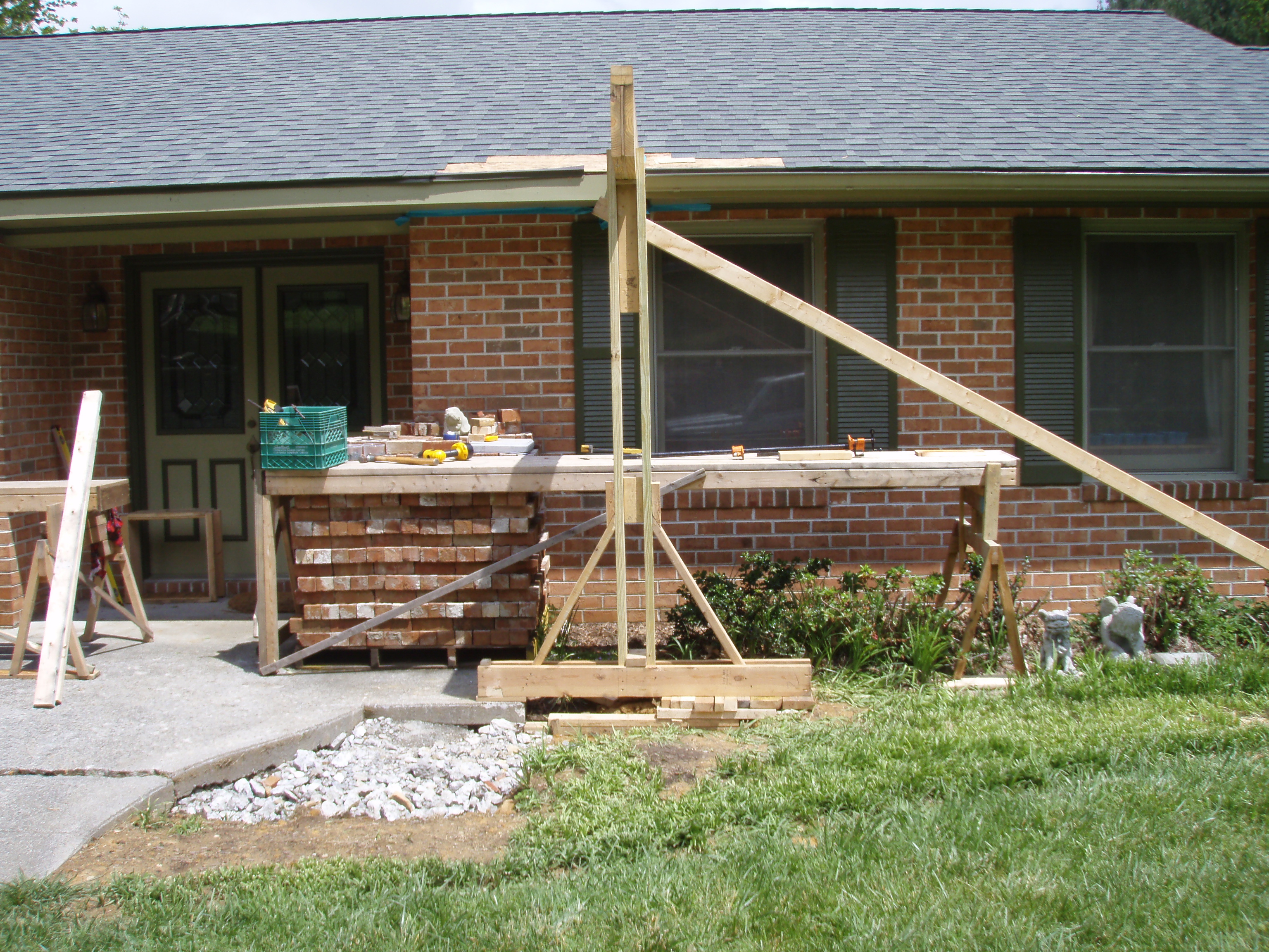 front gable porch with brick raised garden