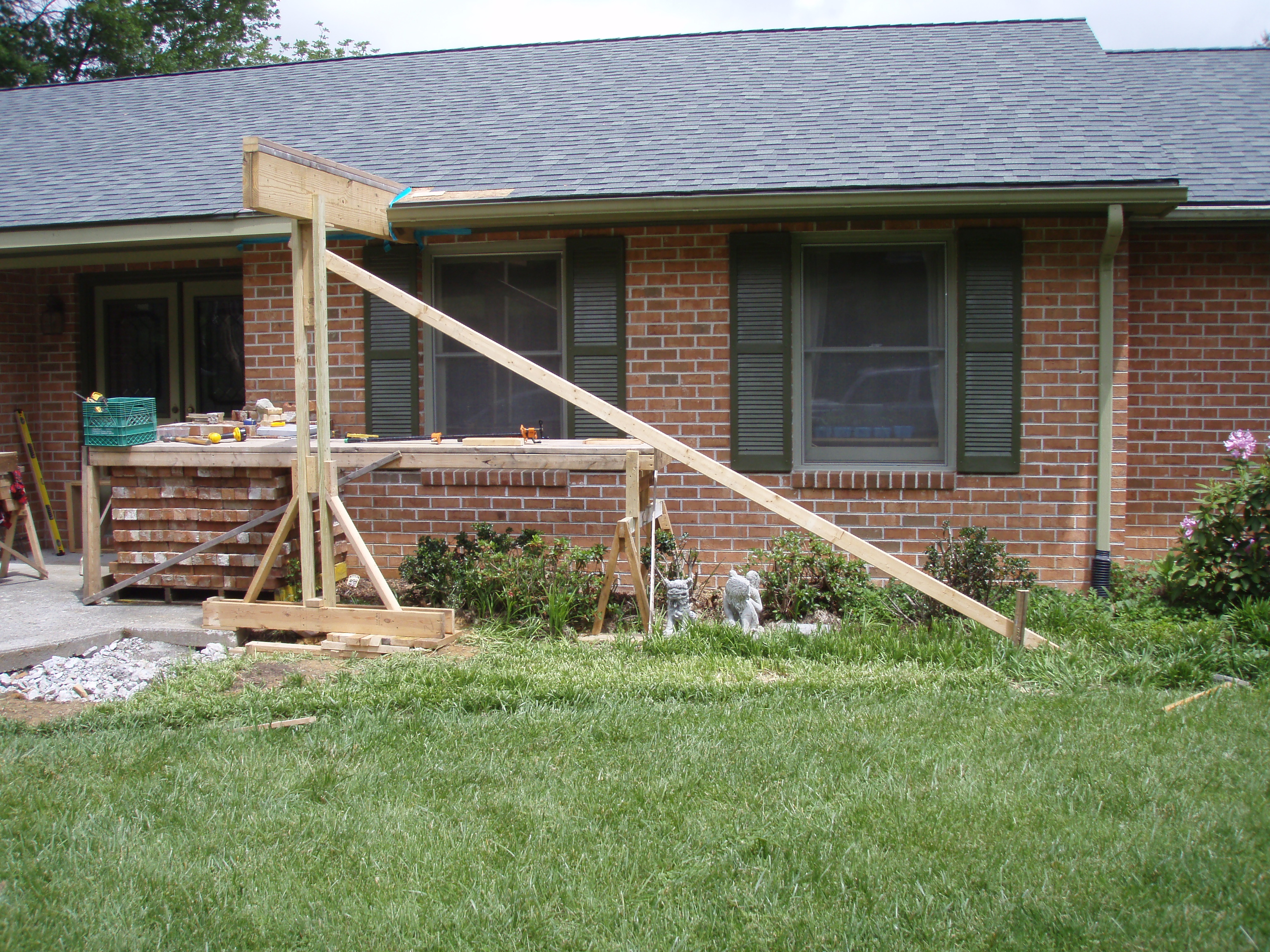 front gable porch with brick raised garden