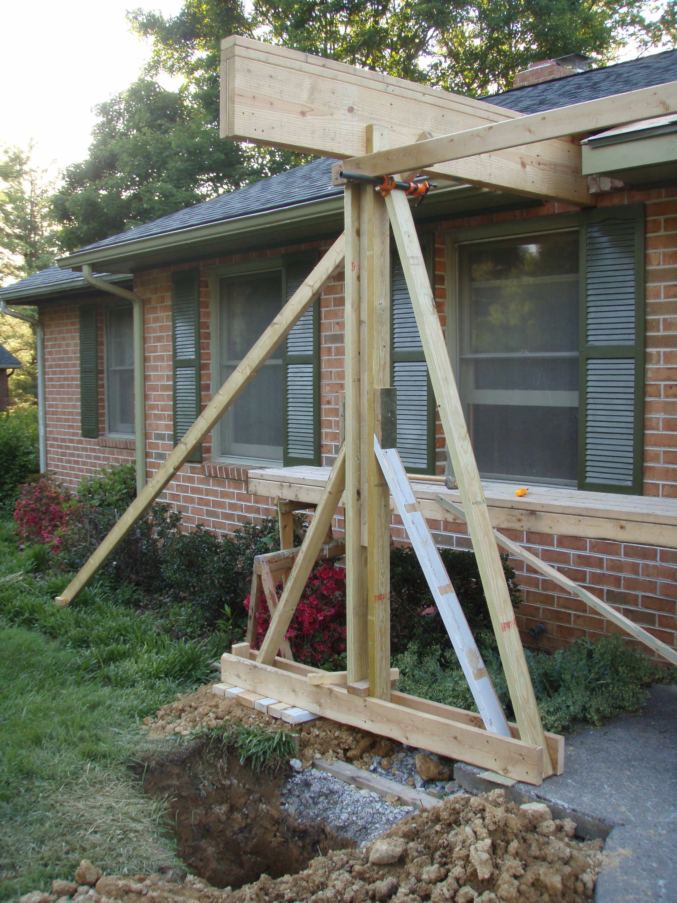 front gable porch with brick raised garden