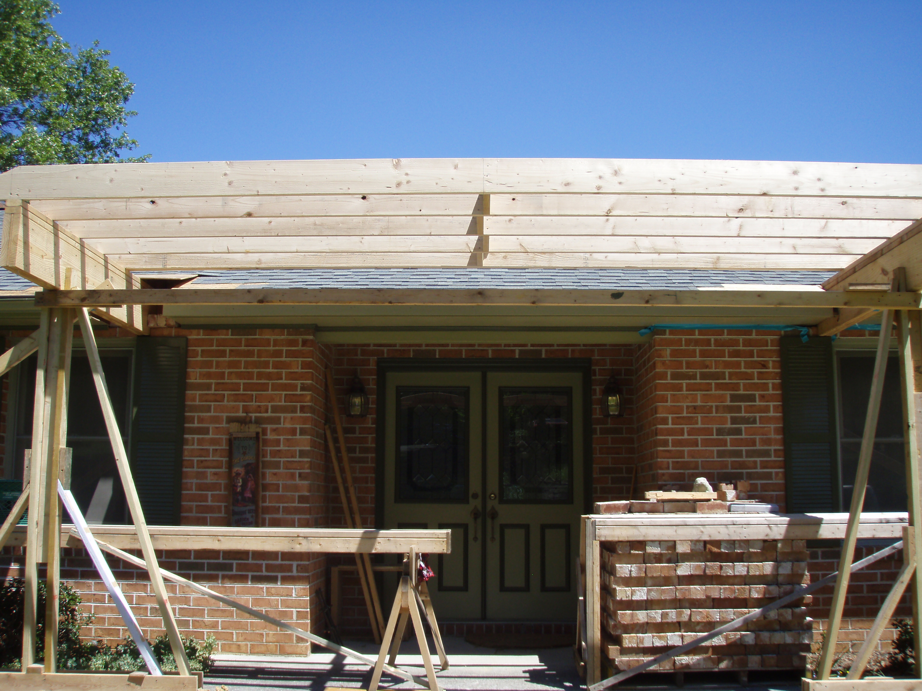 front gable porch with brick raised garden