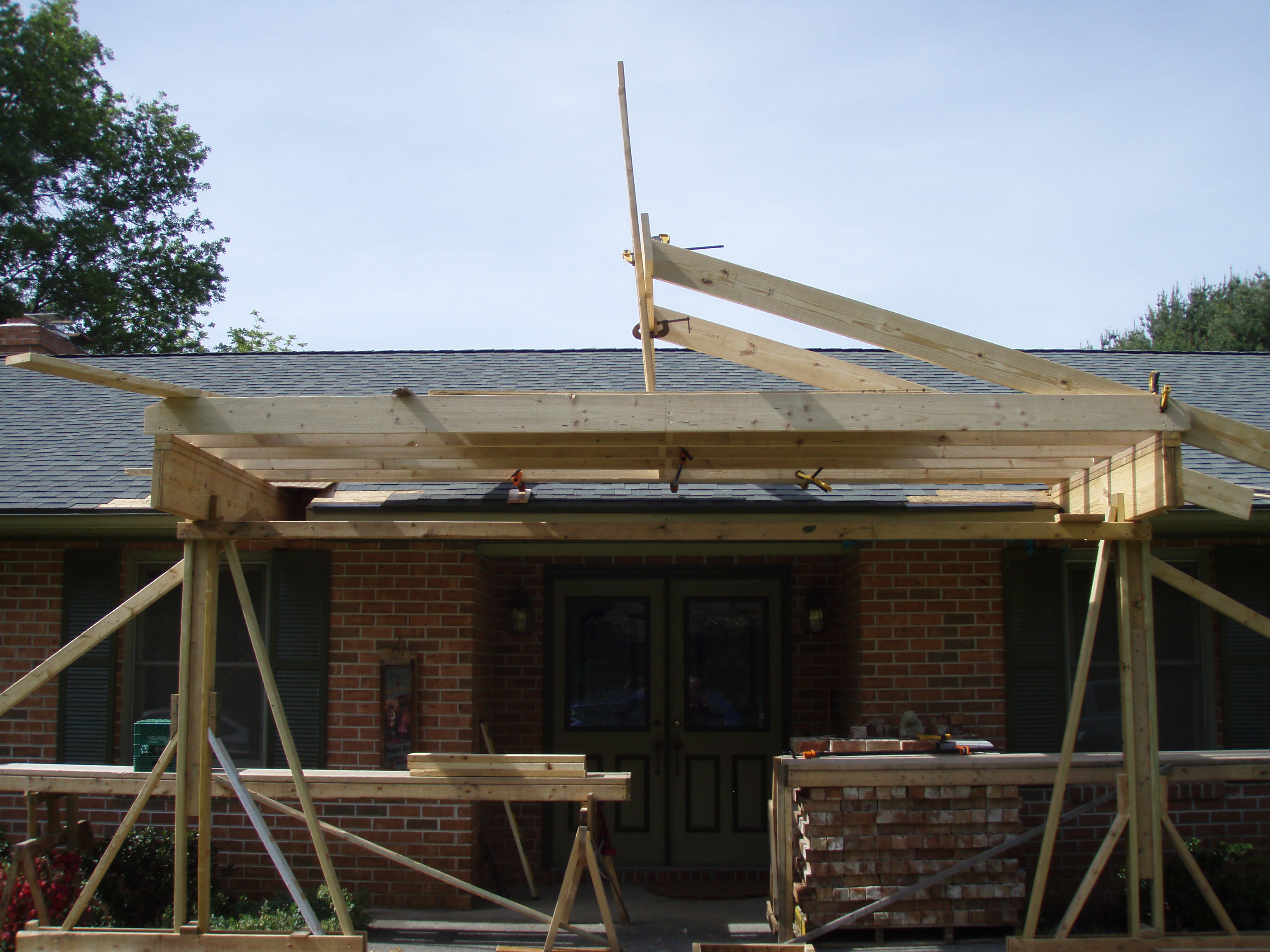 front gable porch with brick raised garden