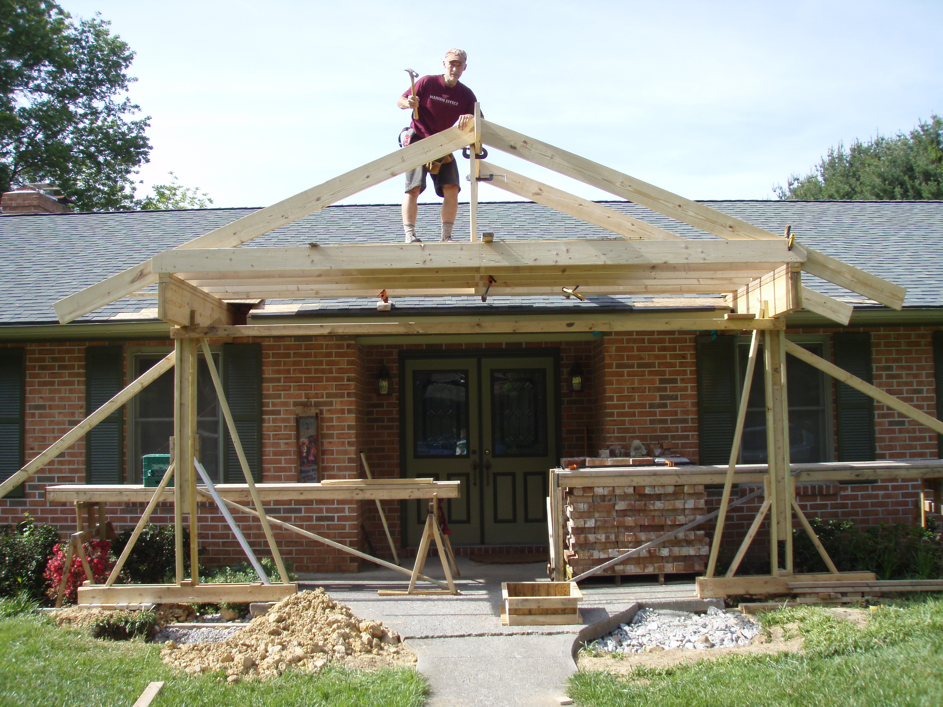 front gable porch with brick raised garden