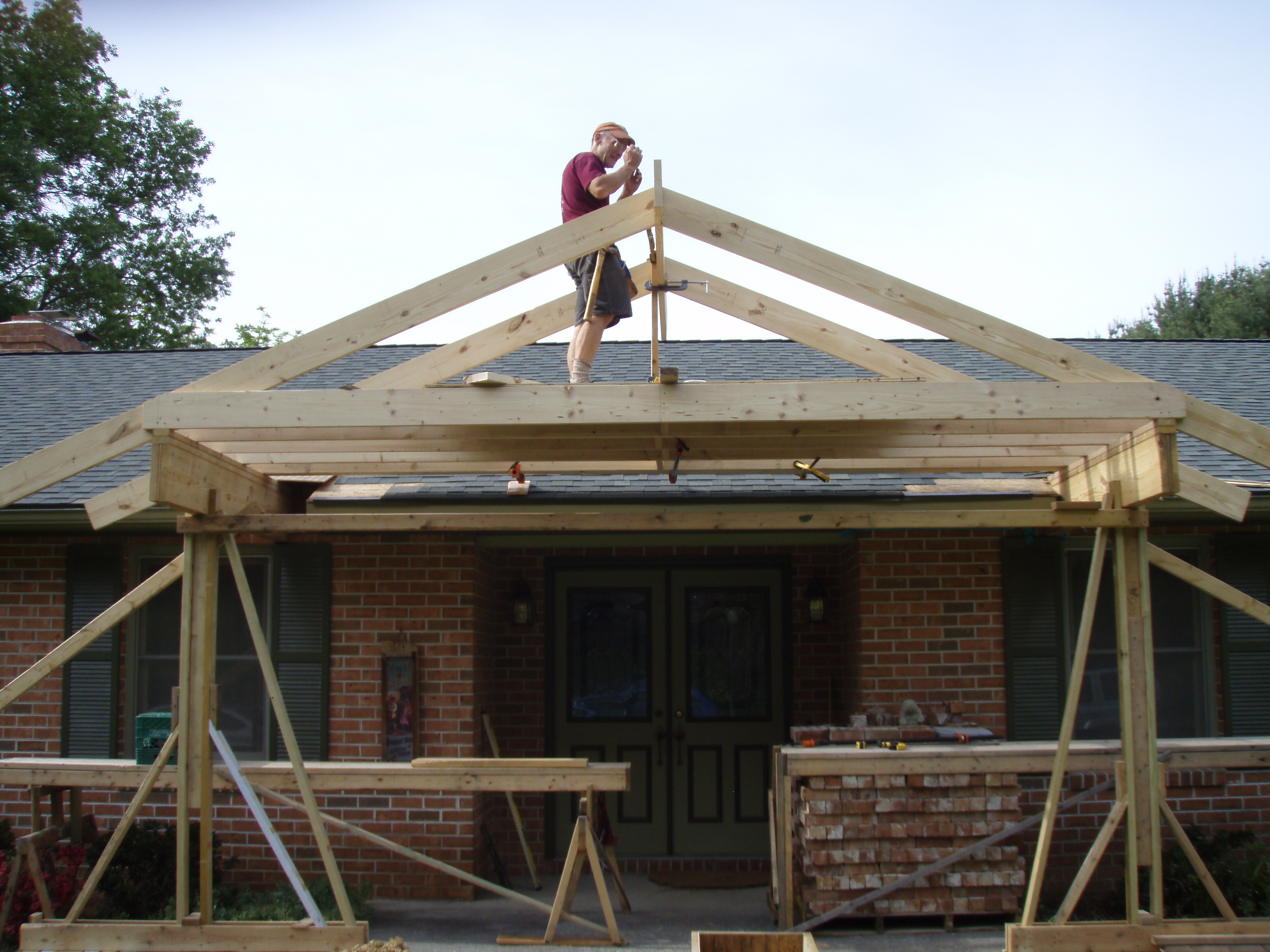 front gable porch with brick raised garden