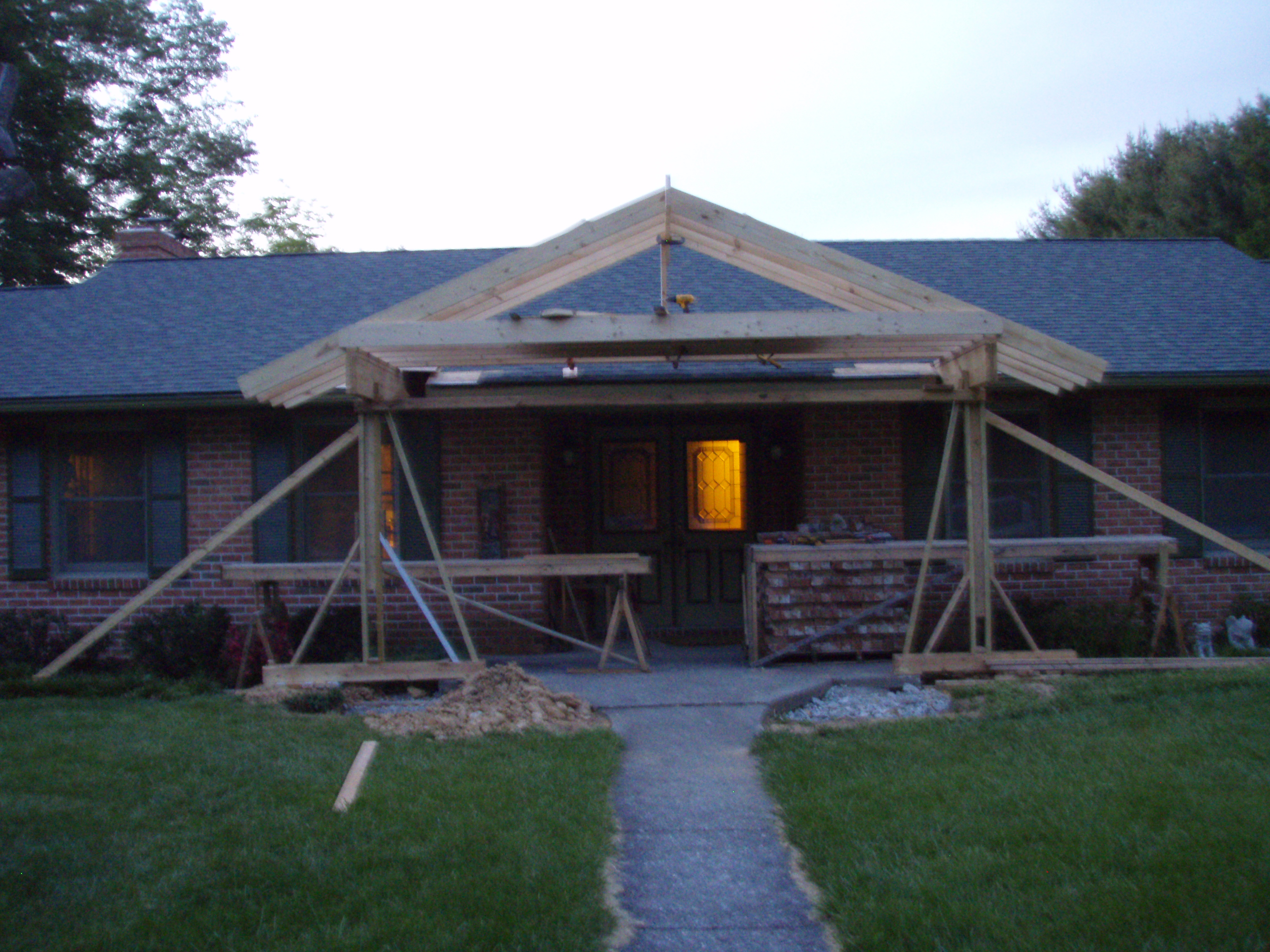 front gable porch with brick raised garden