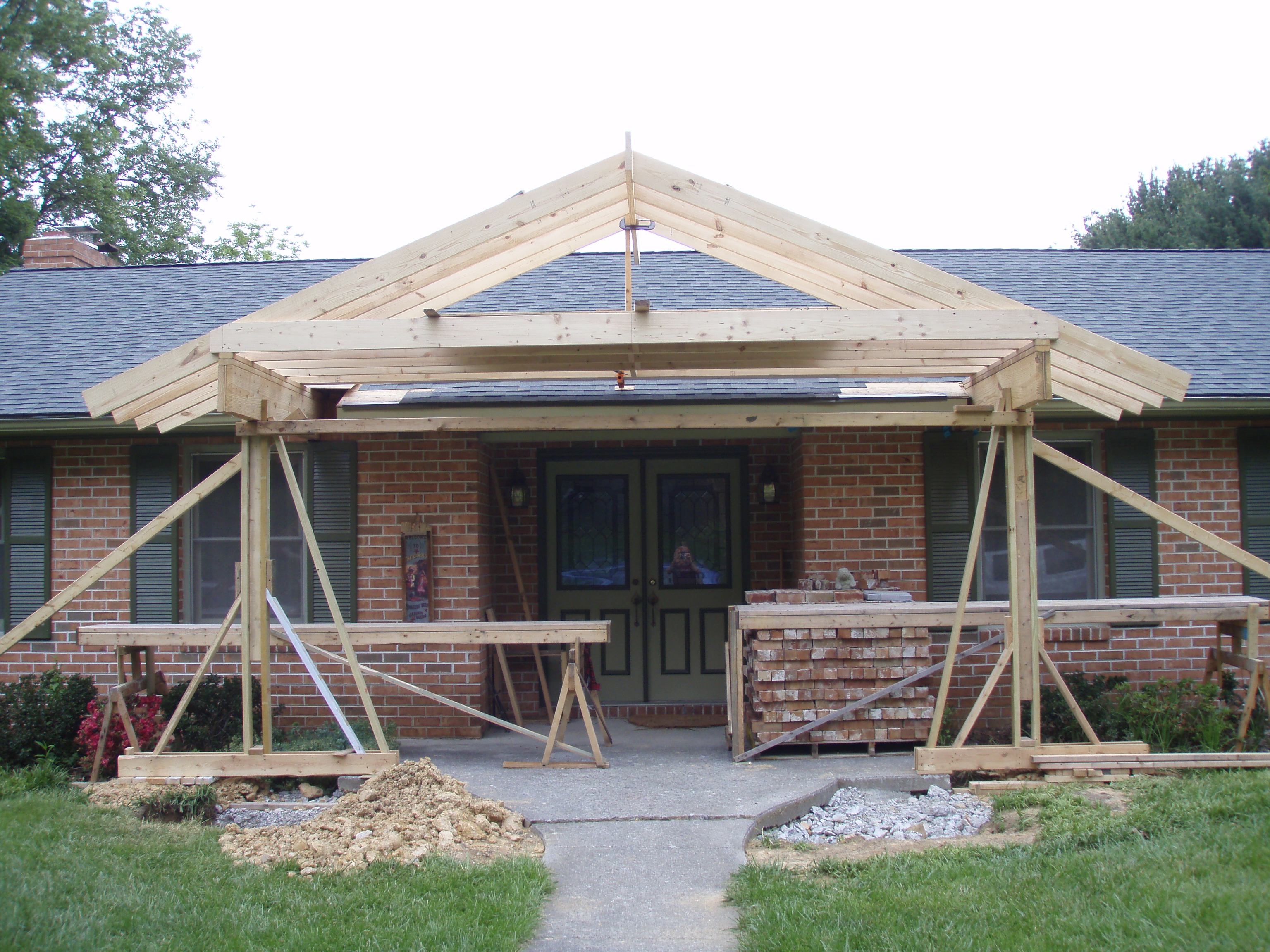 front gable porch with brick raised garden