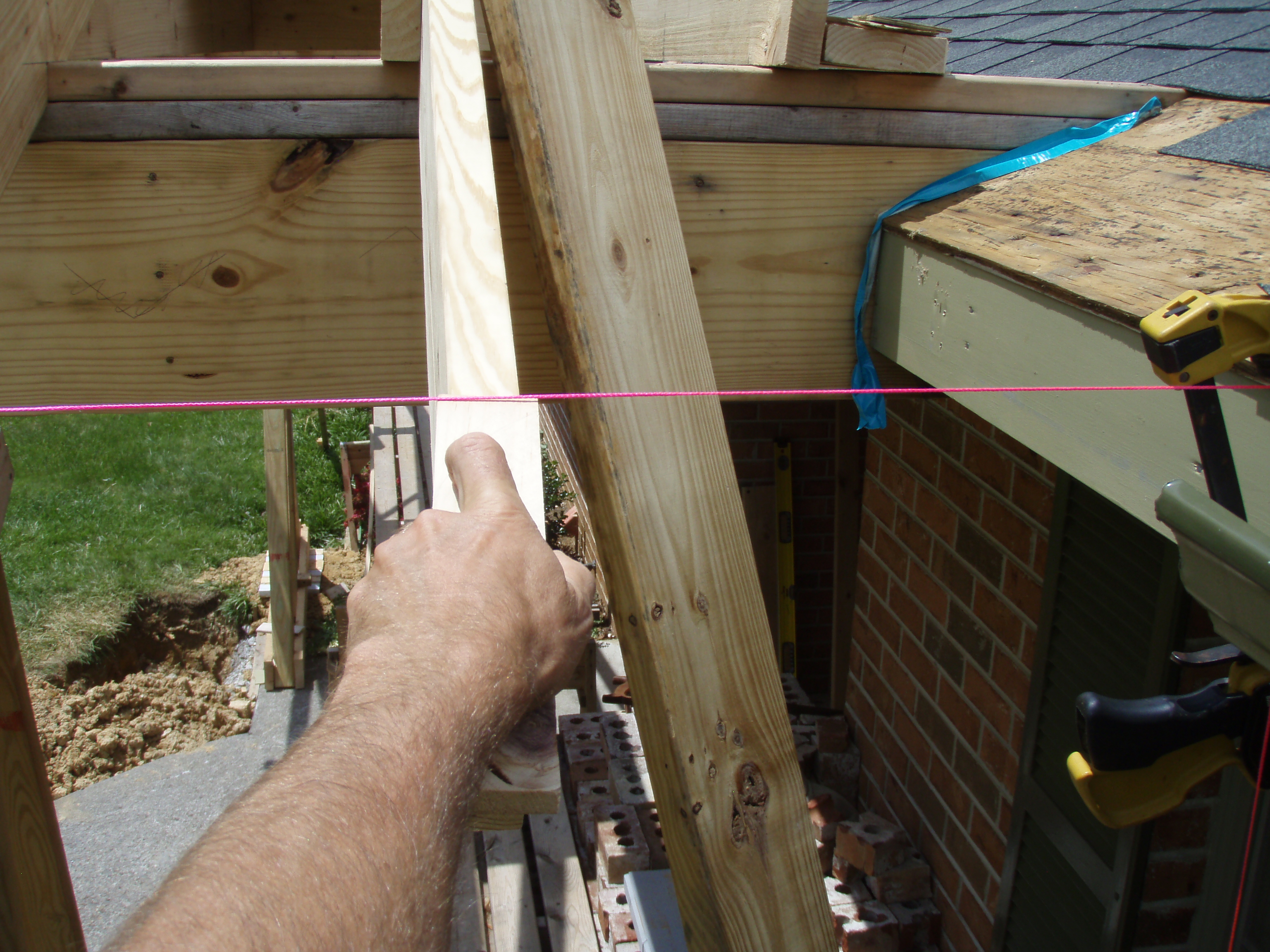 front gable porch with brick raised garden