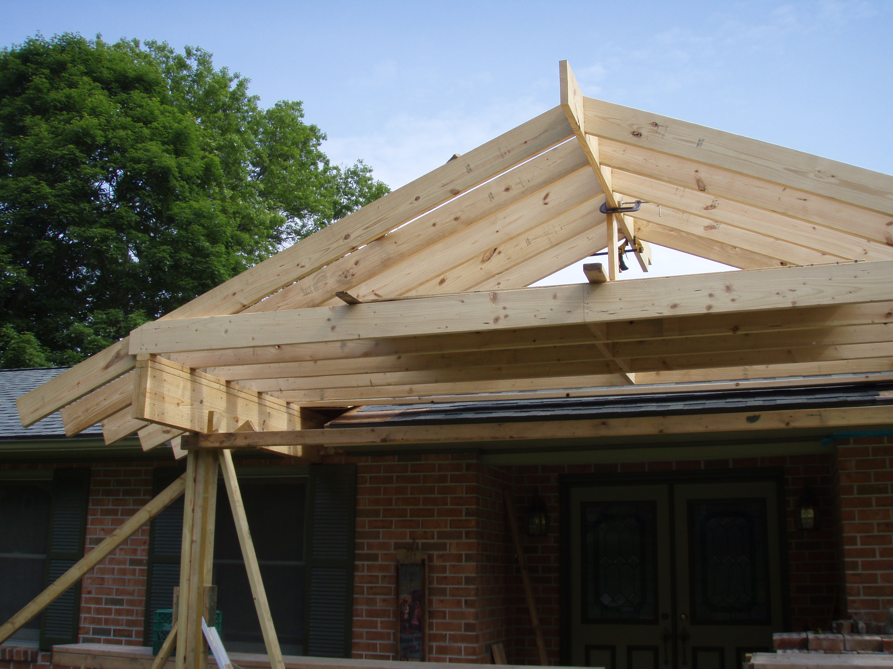 front gable porch with brick raised garden