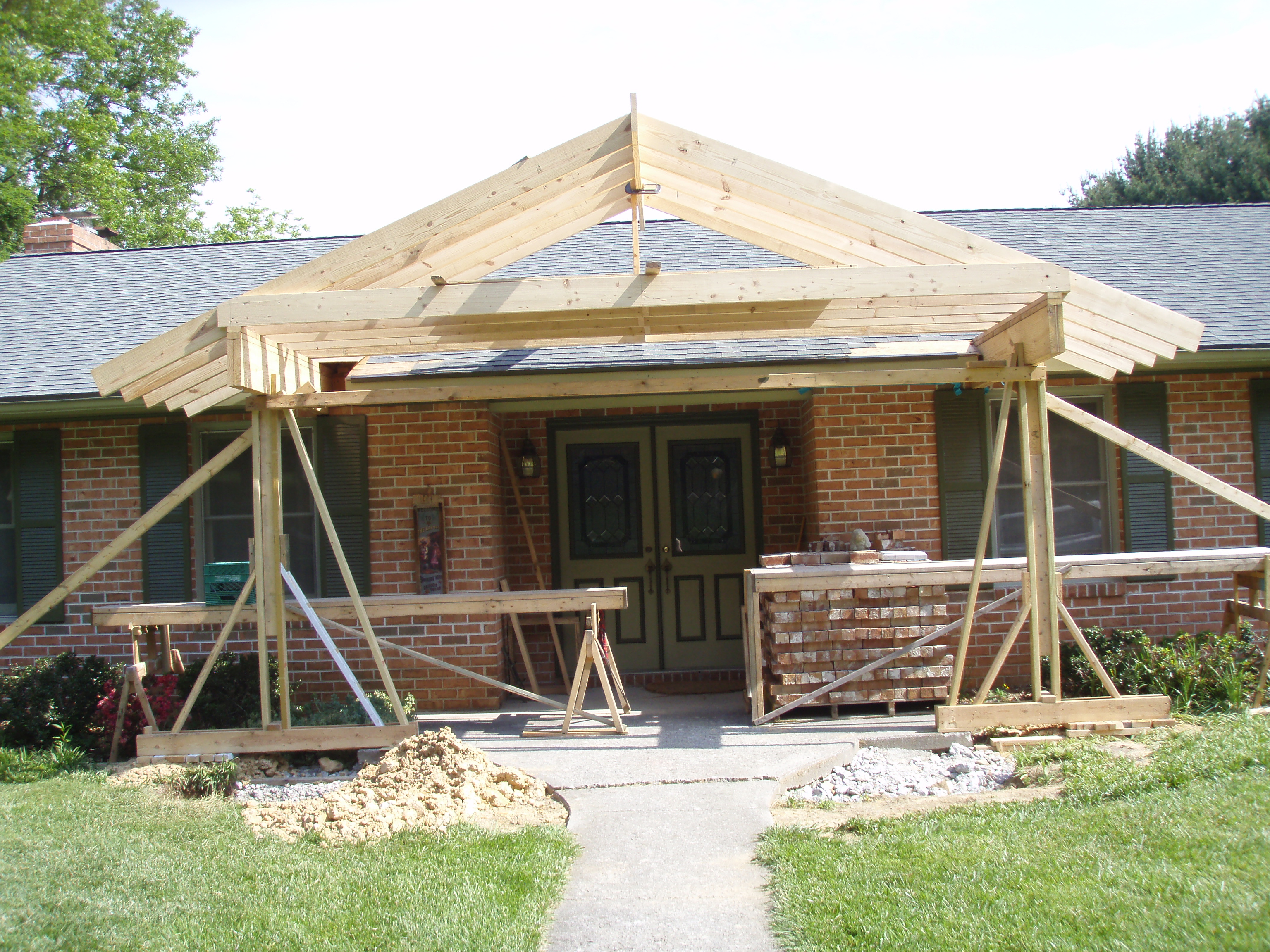 front gable porch with brick raised garden