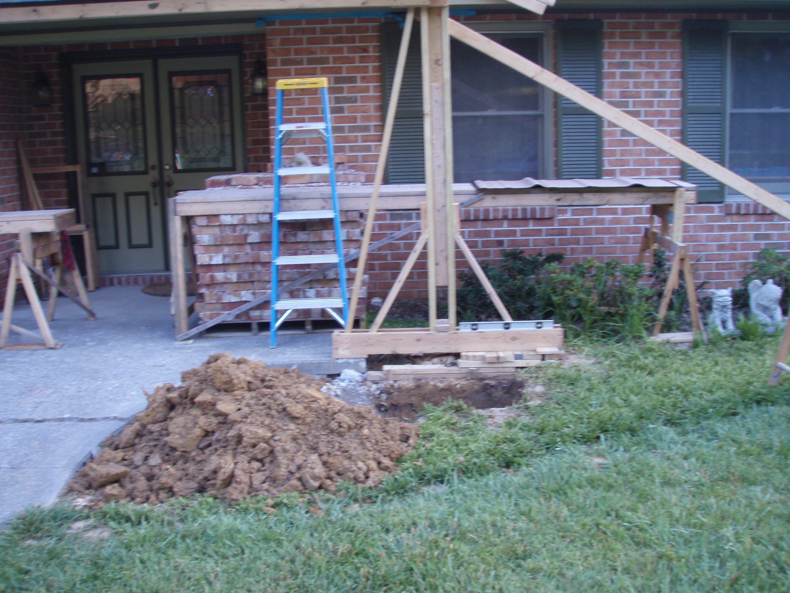 front gable porch with brick raised garden