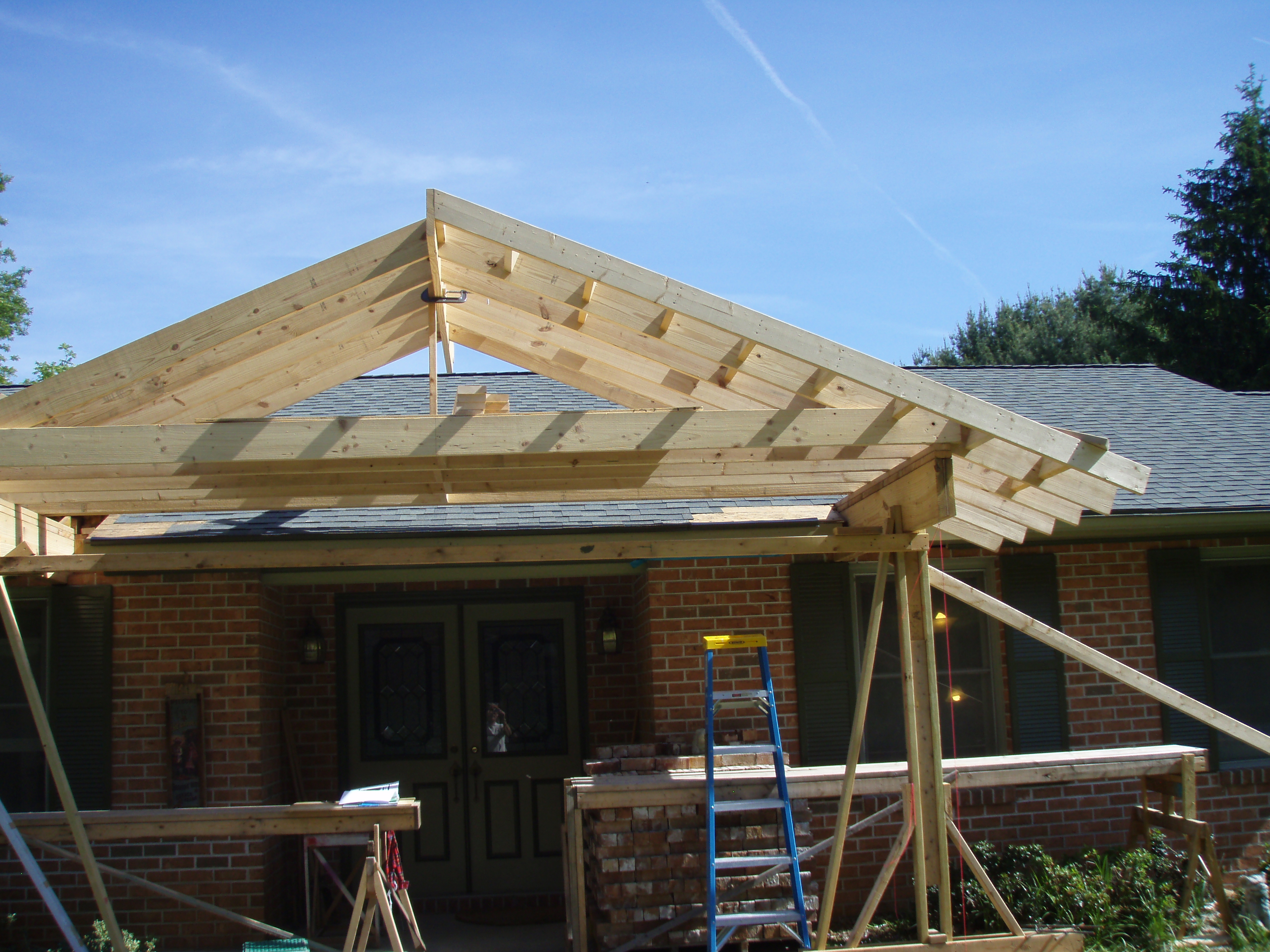 front gable porch with brick raised garden