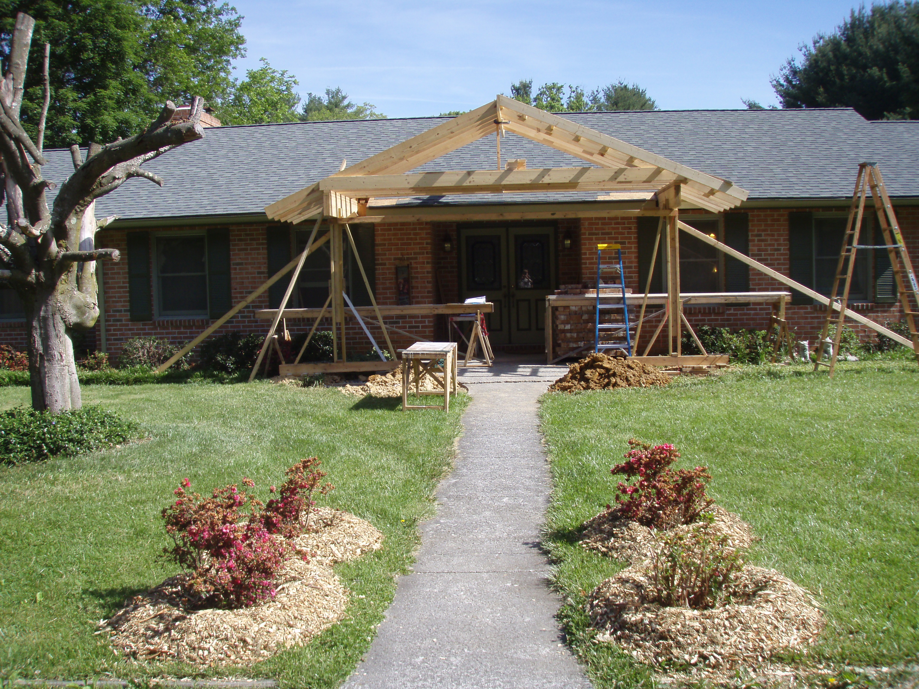 front gable porch with brick raised garden