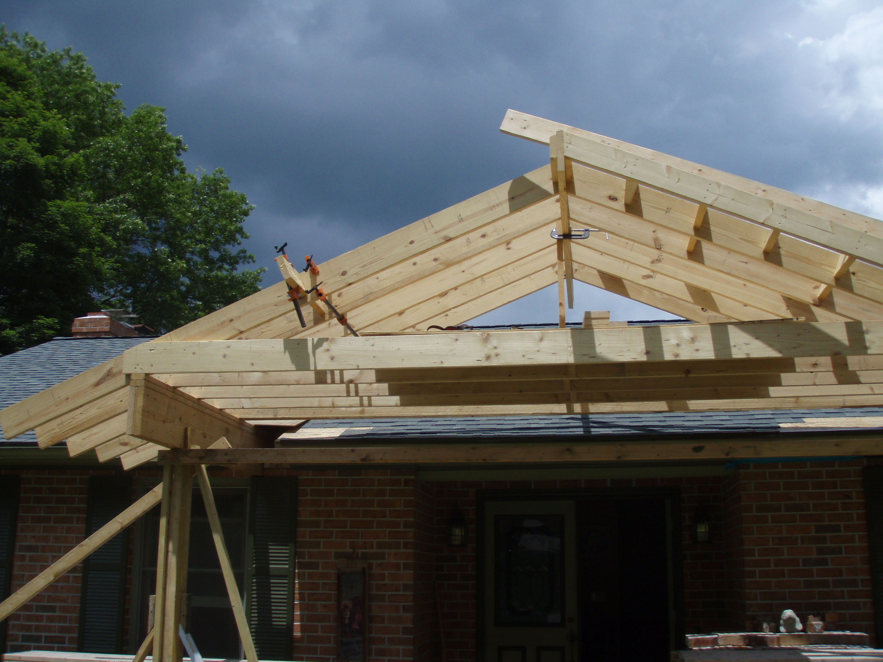 front gable porch with brick raised garden