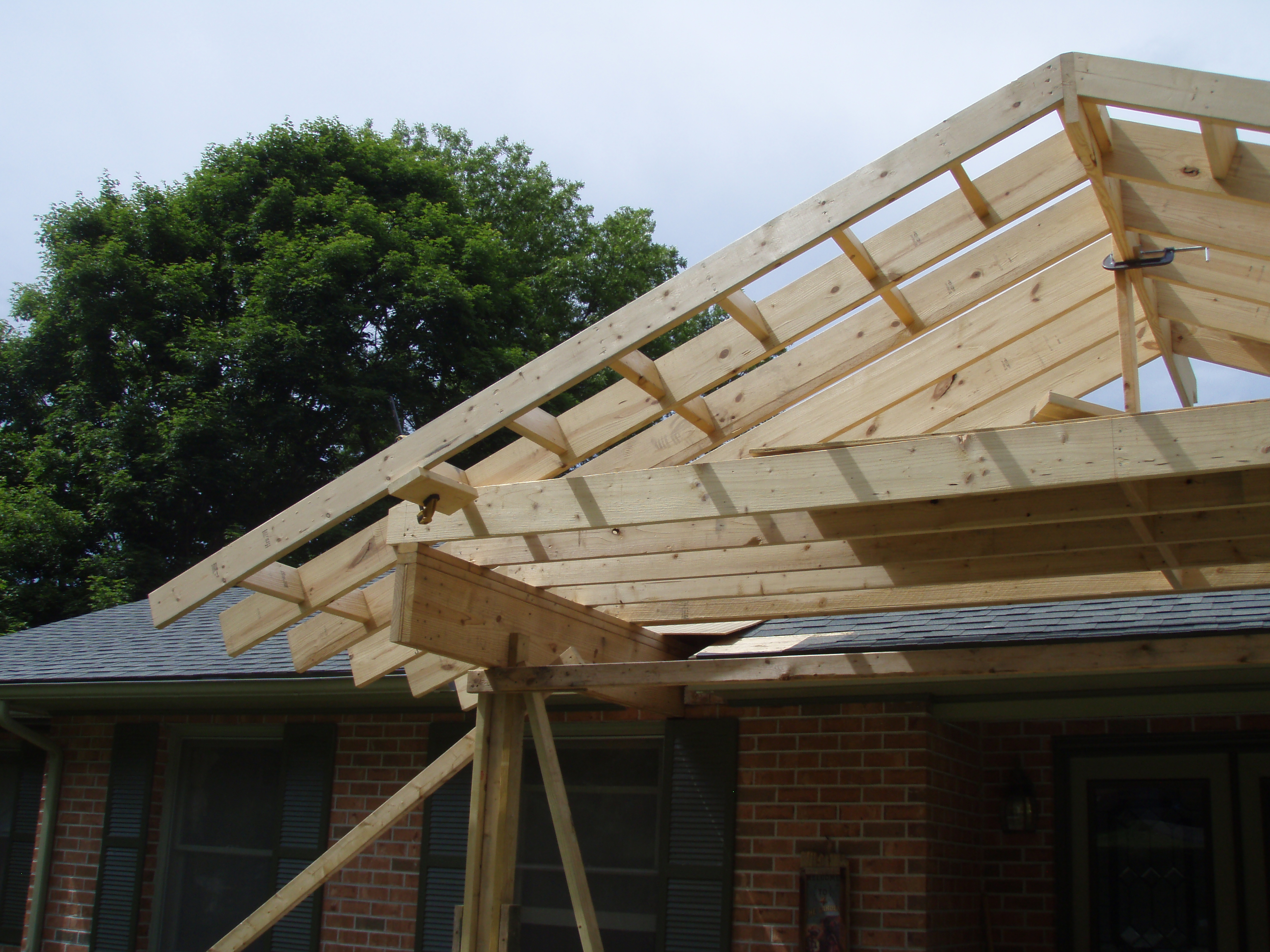 front gable porch with brick raised garden