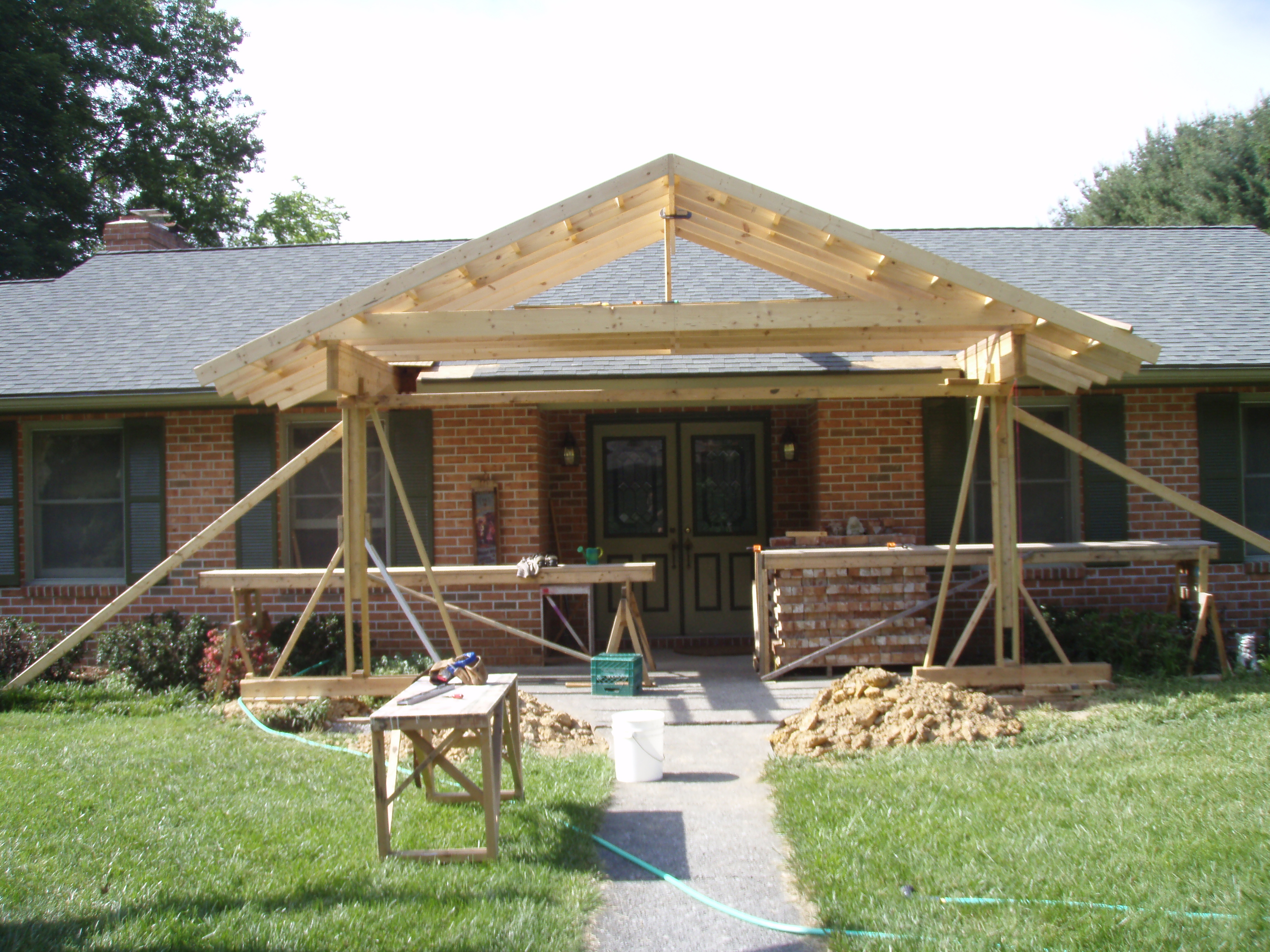 front gable porch with brick raised garden