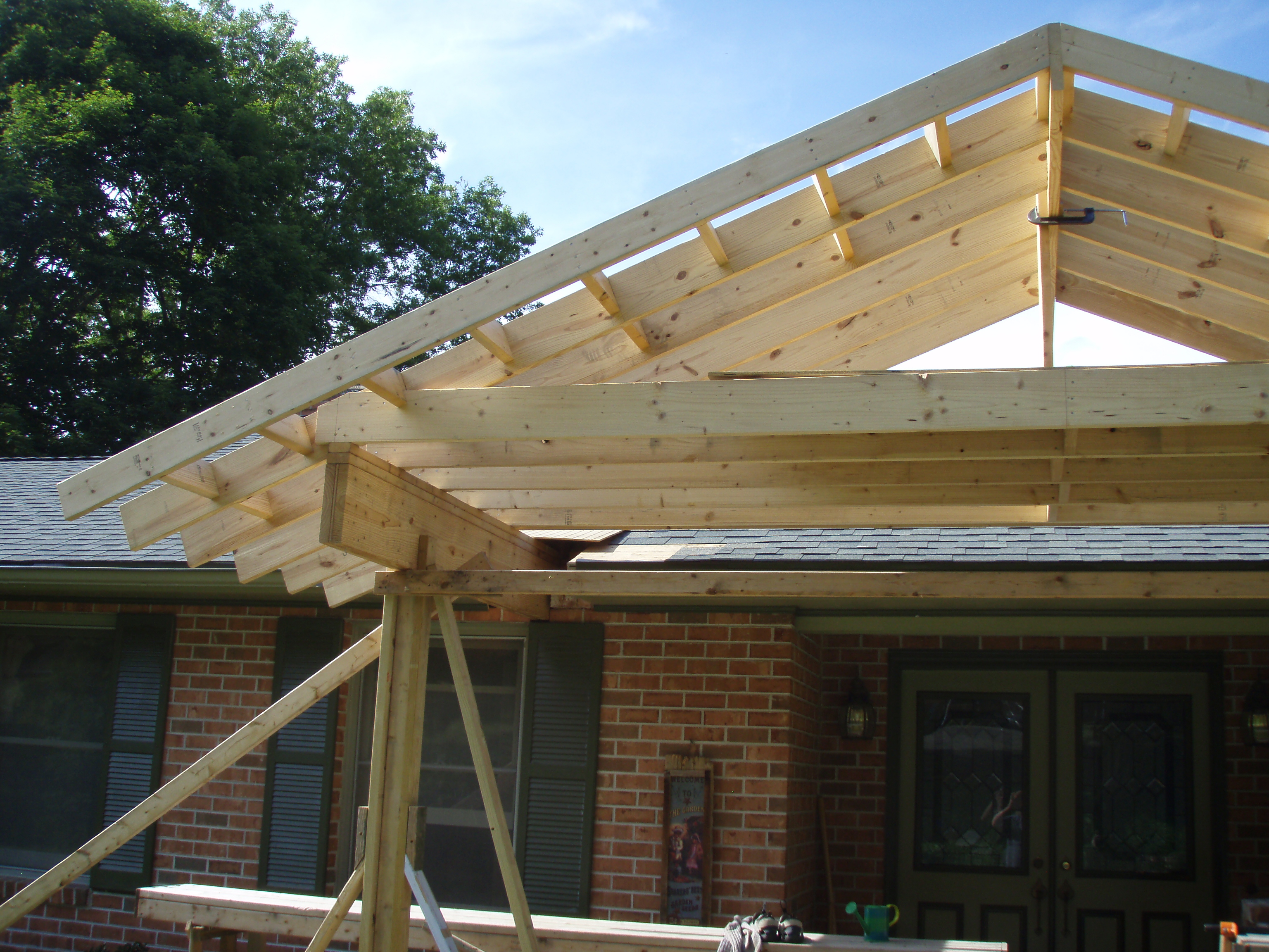 front gable porch with brick raised garden