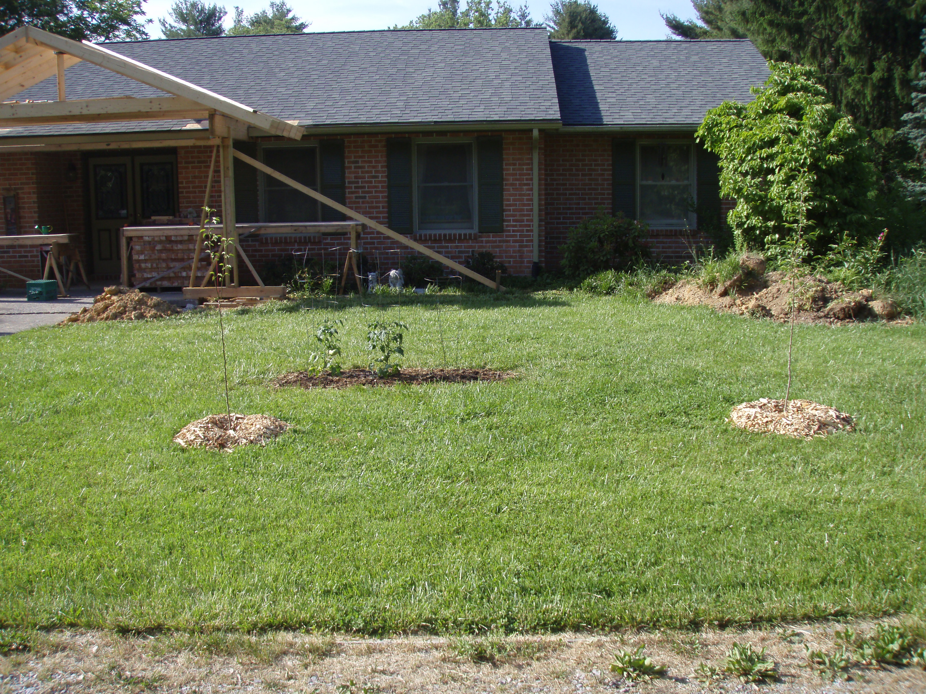 front gable porch with brick raised garden