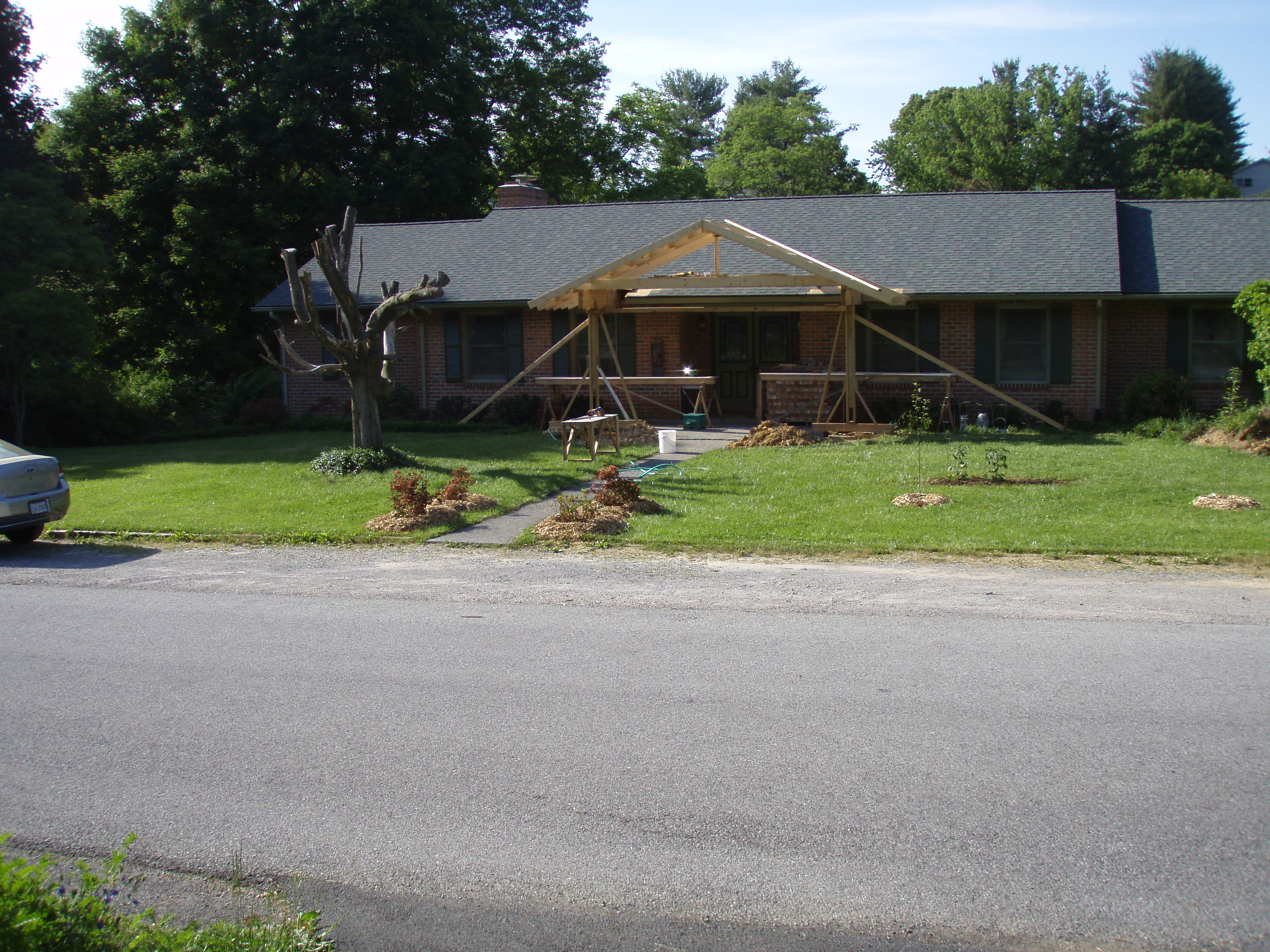 front gable porch with brick raised garden