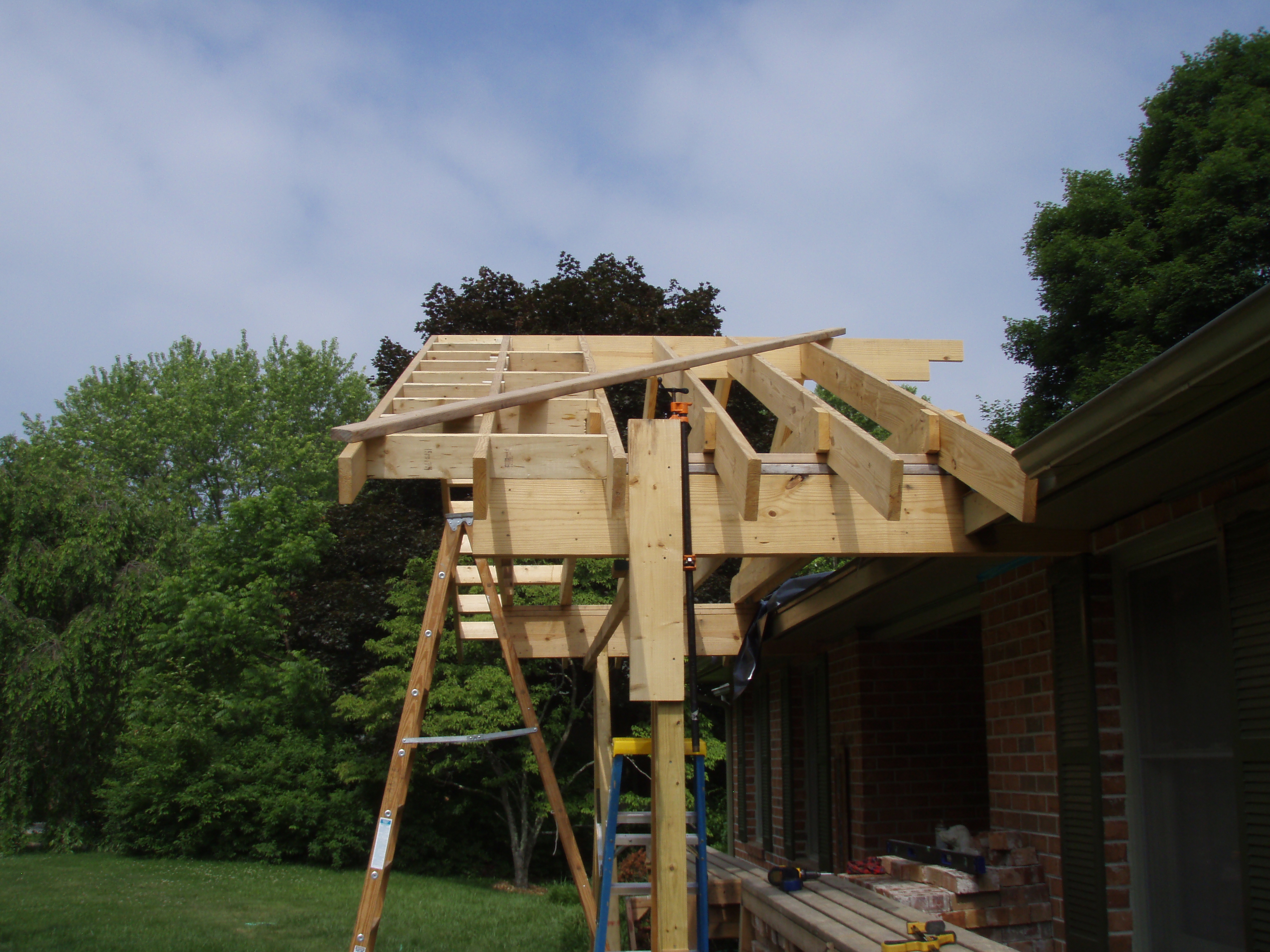 front gable porch with brick raised garden