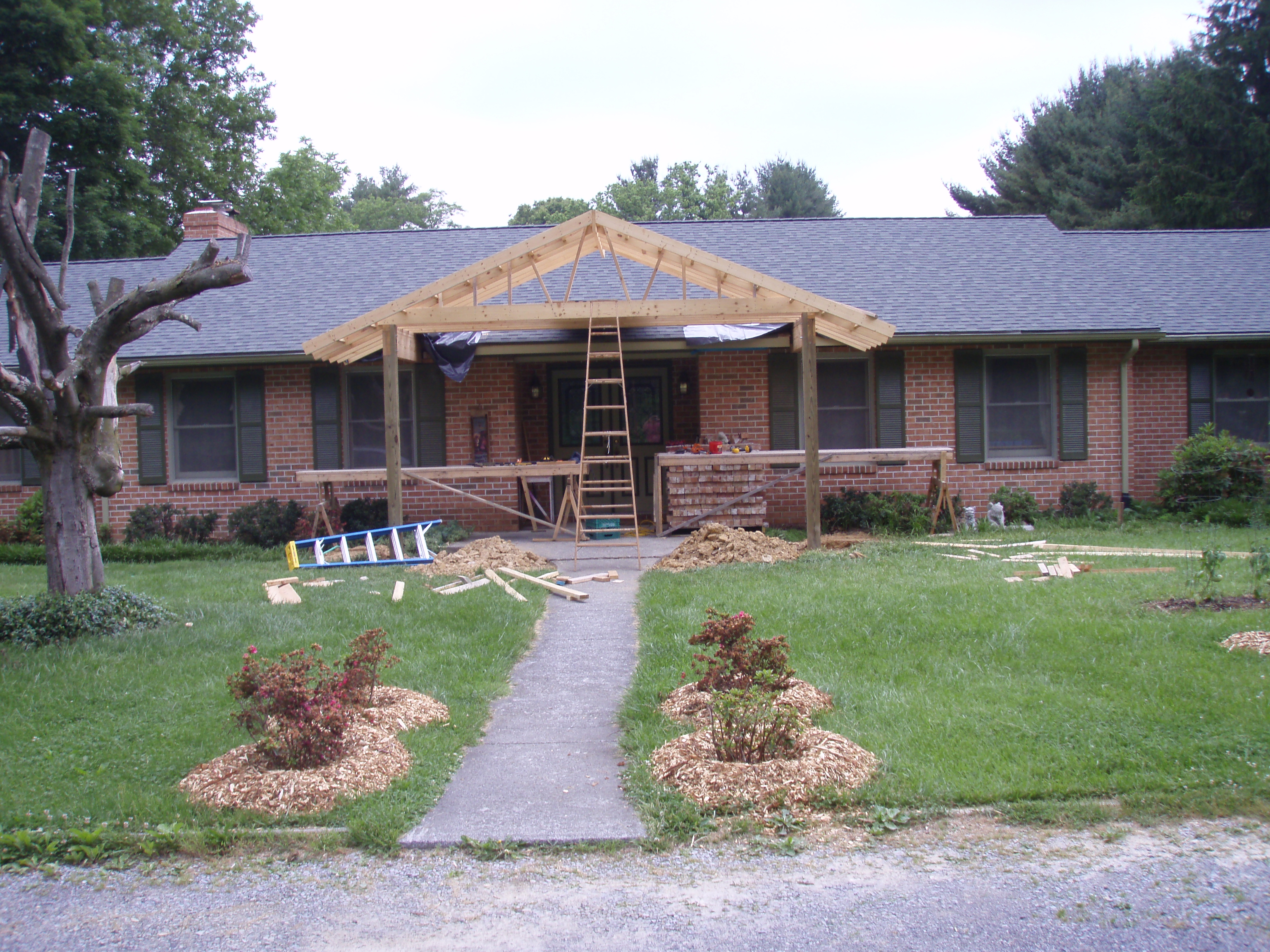 front gable porch with brick raised garden