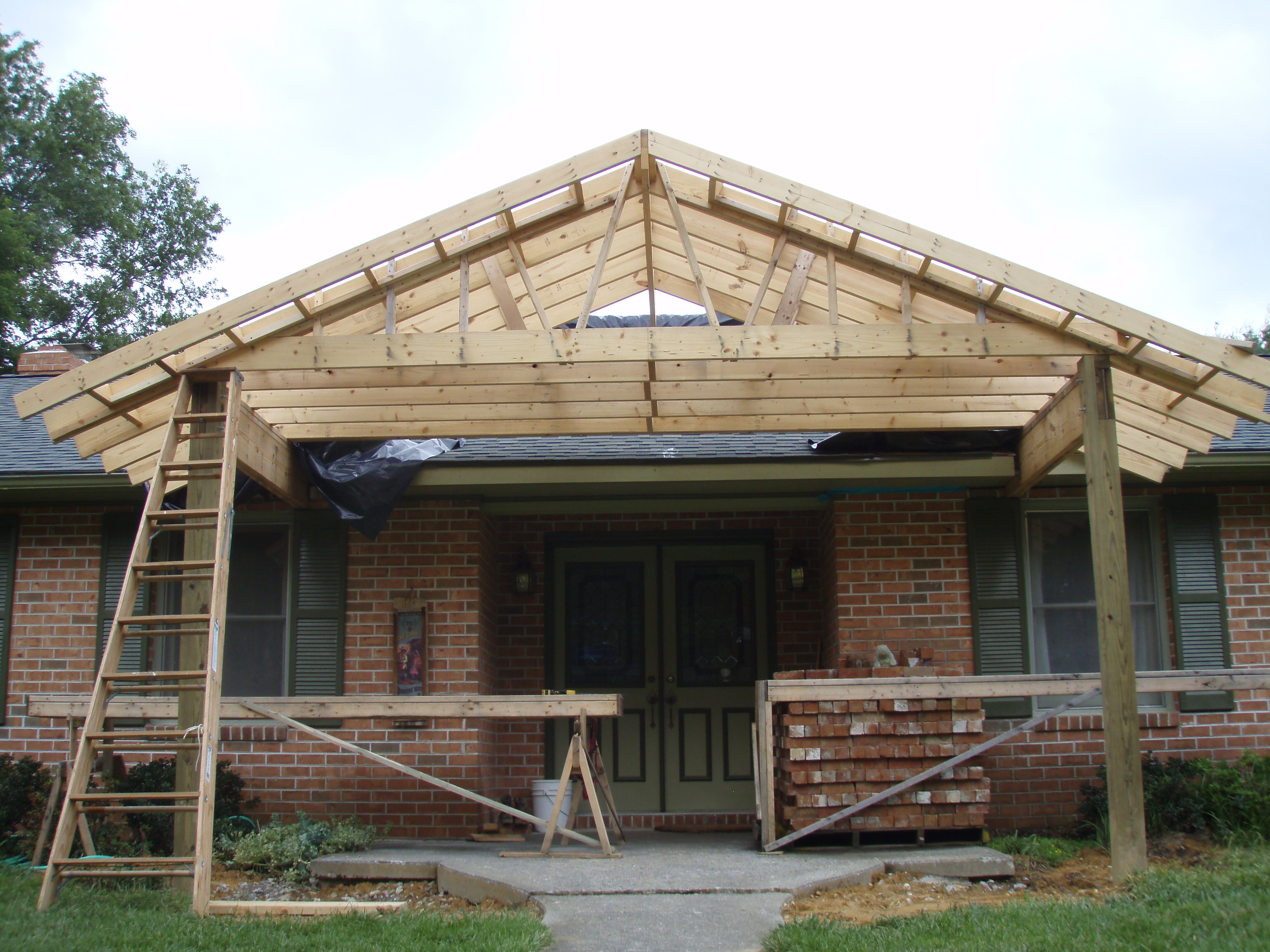 front gable porch with brick raised garden