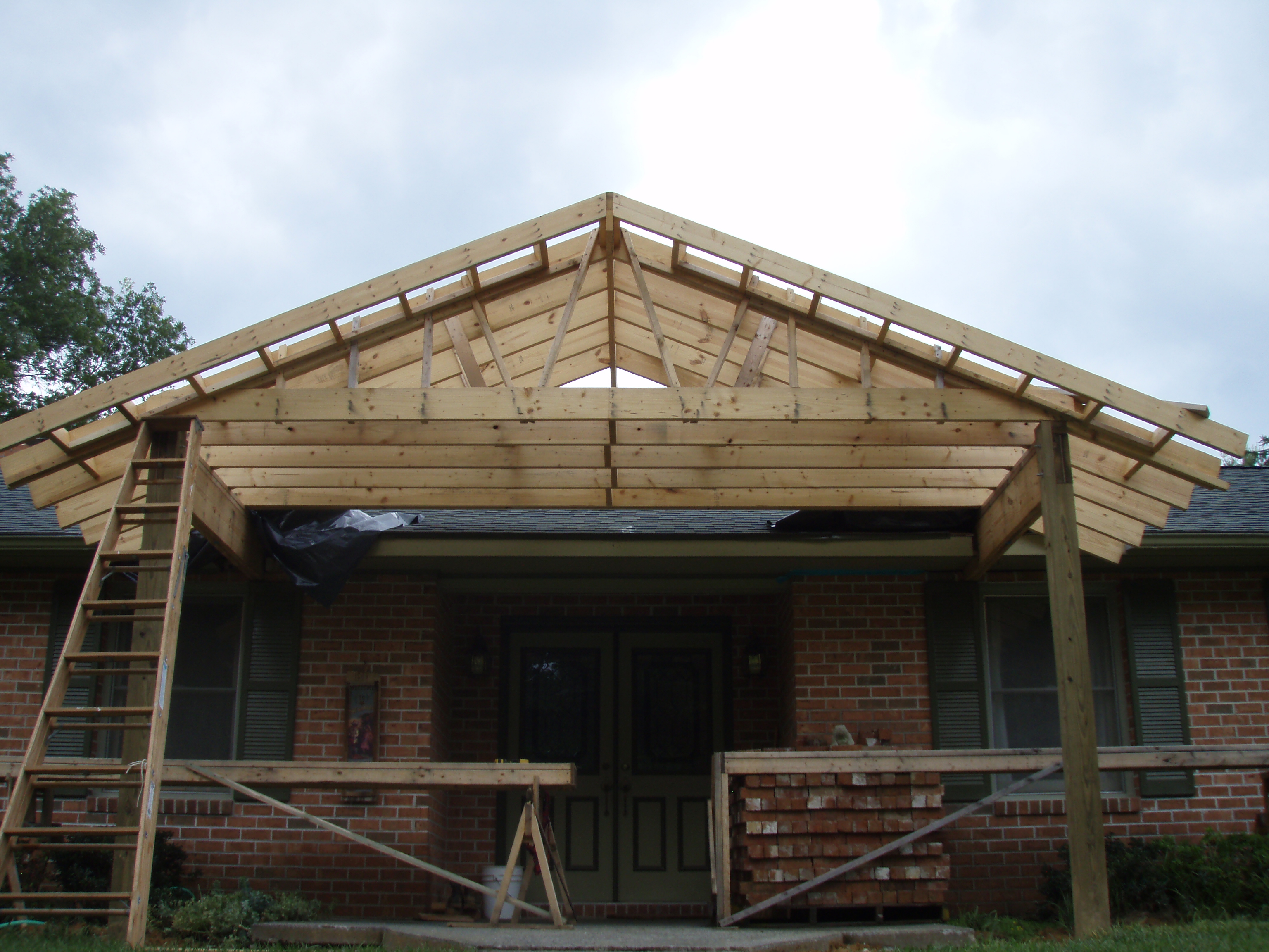 front gable porch with brick raised garden