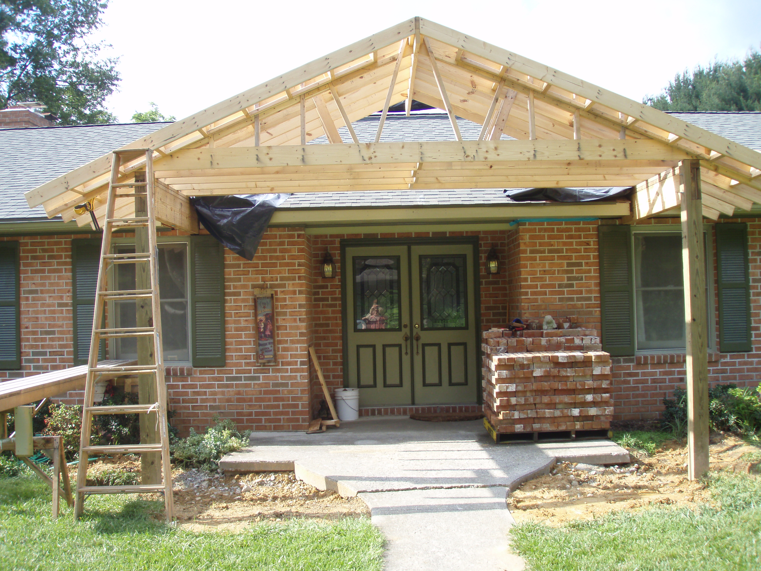 front gable porch with brick raised garden