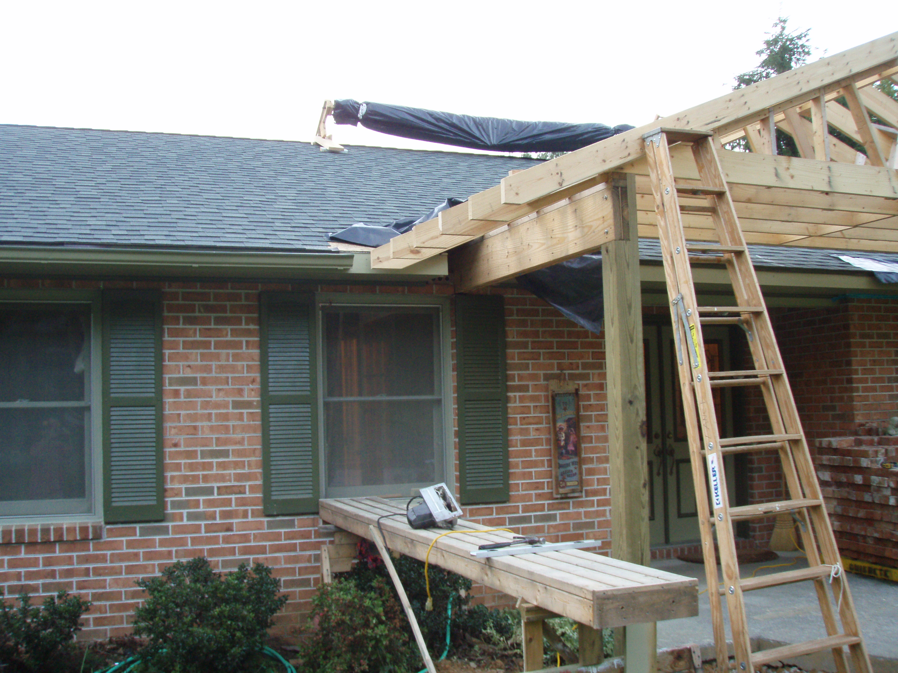 front gable porch with brick raised garden