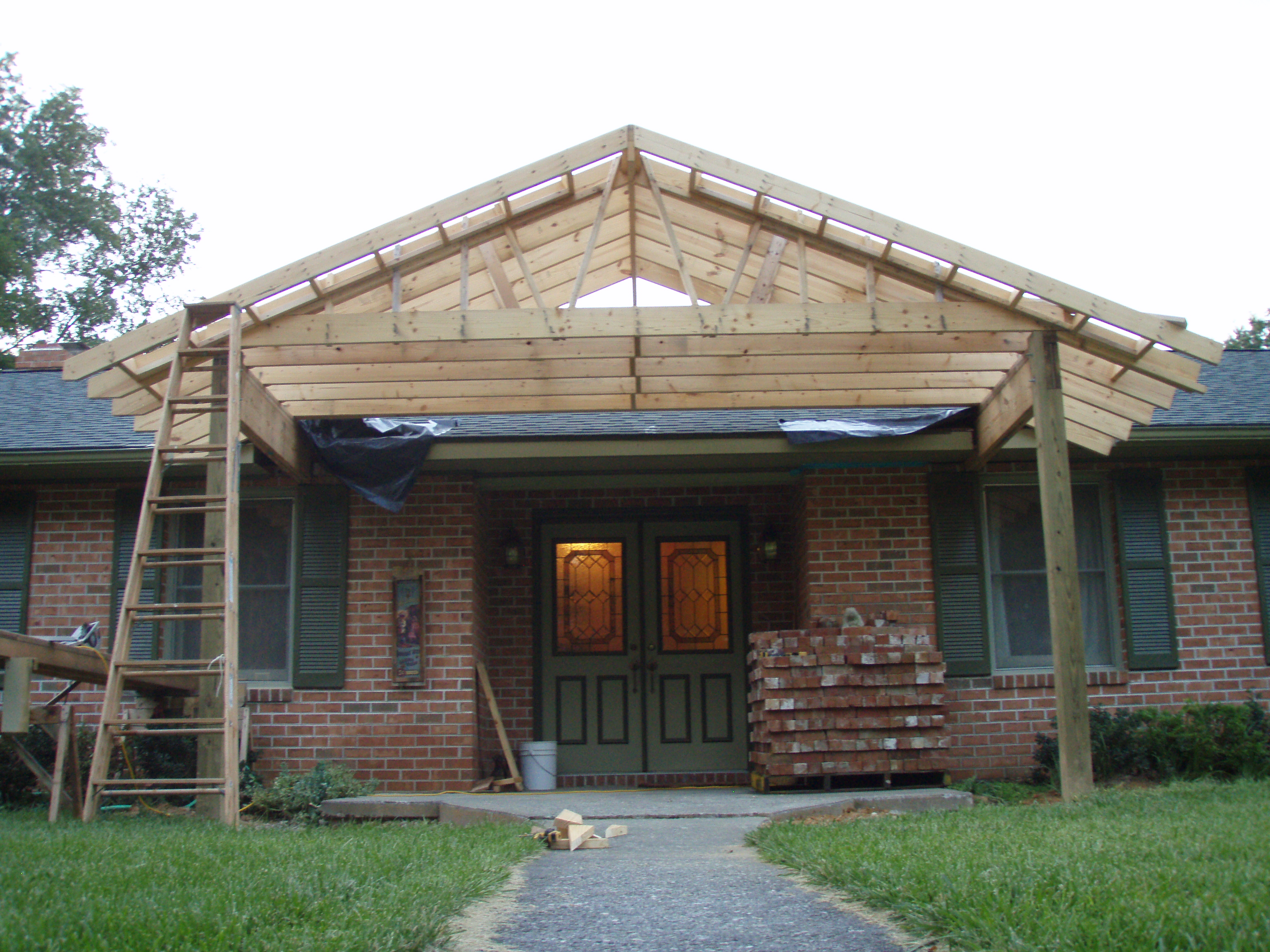 front gable porch with brick raised garden