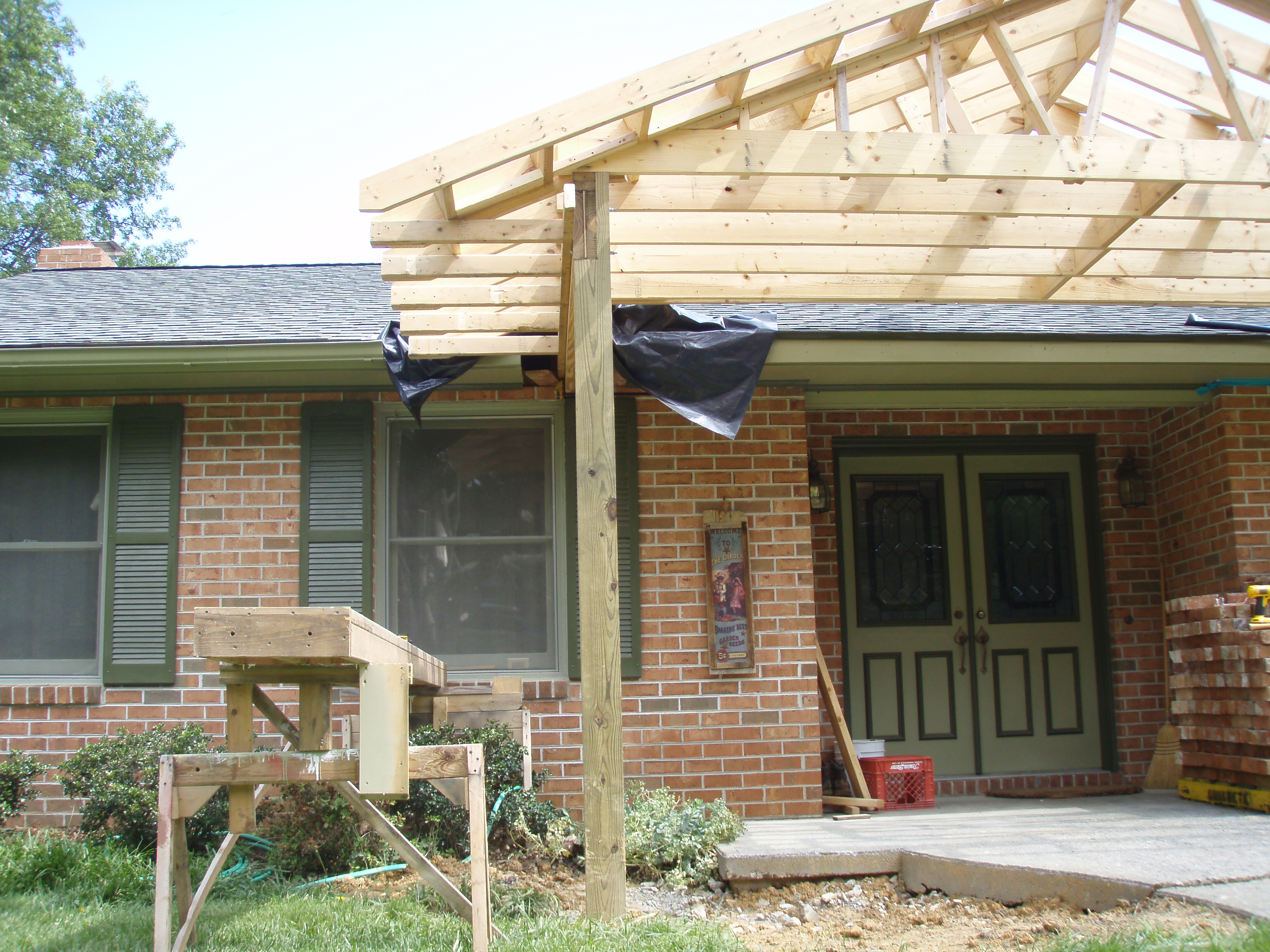 front gable porch with brick raised garden