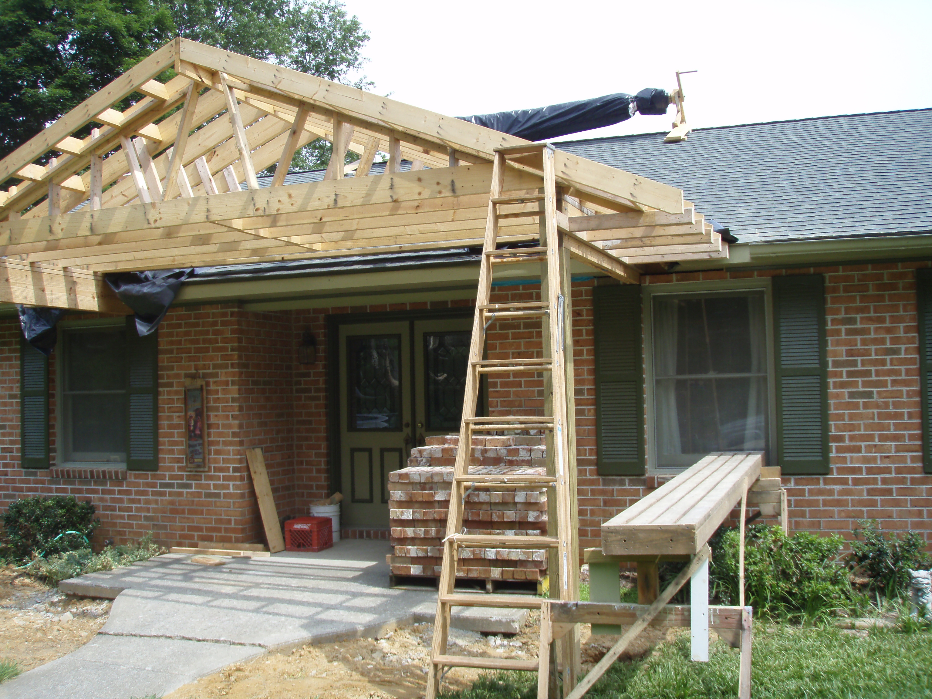 front gable porch with brick raised garden