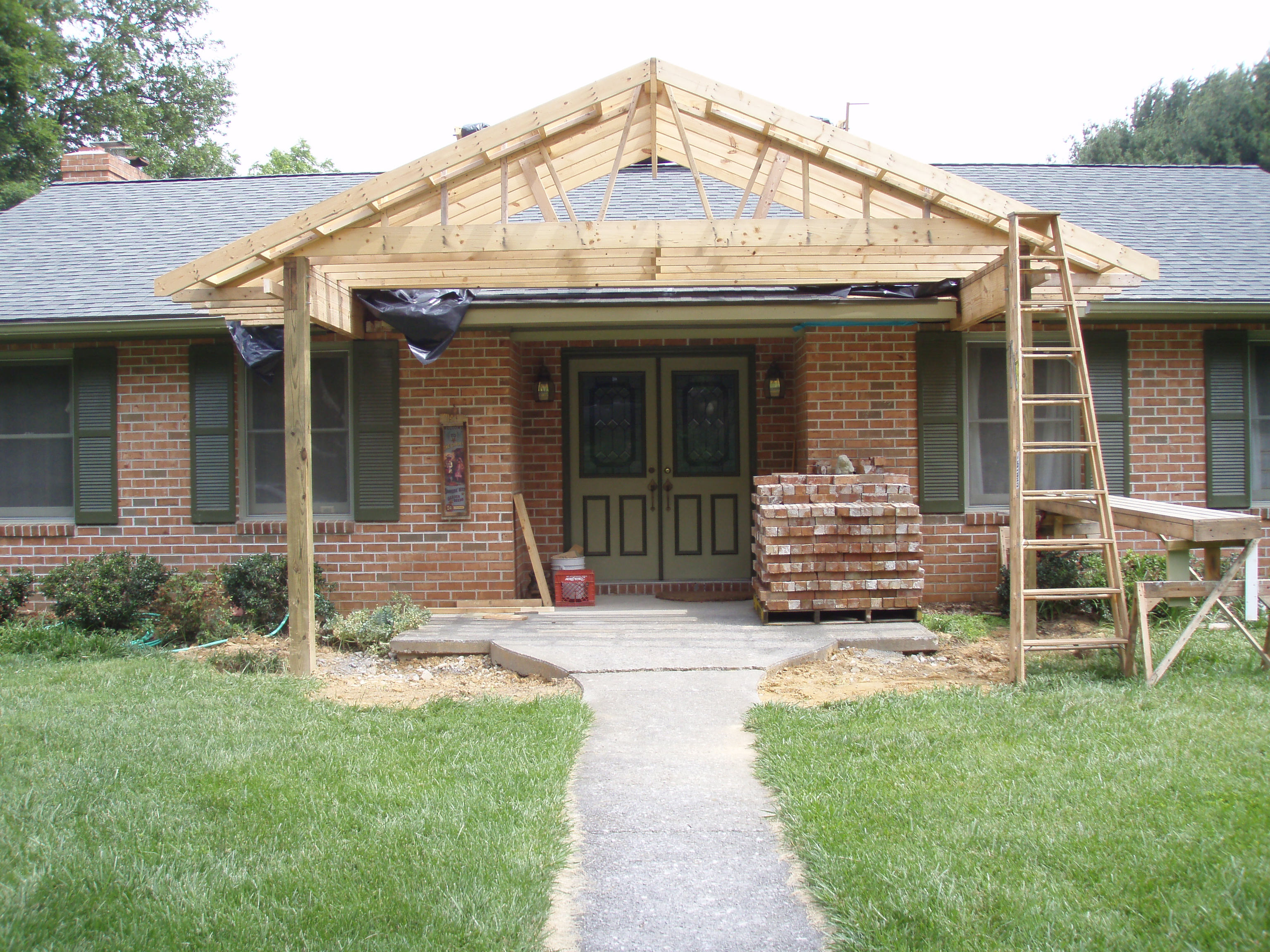 front gable porch with brick raised garden