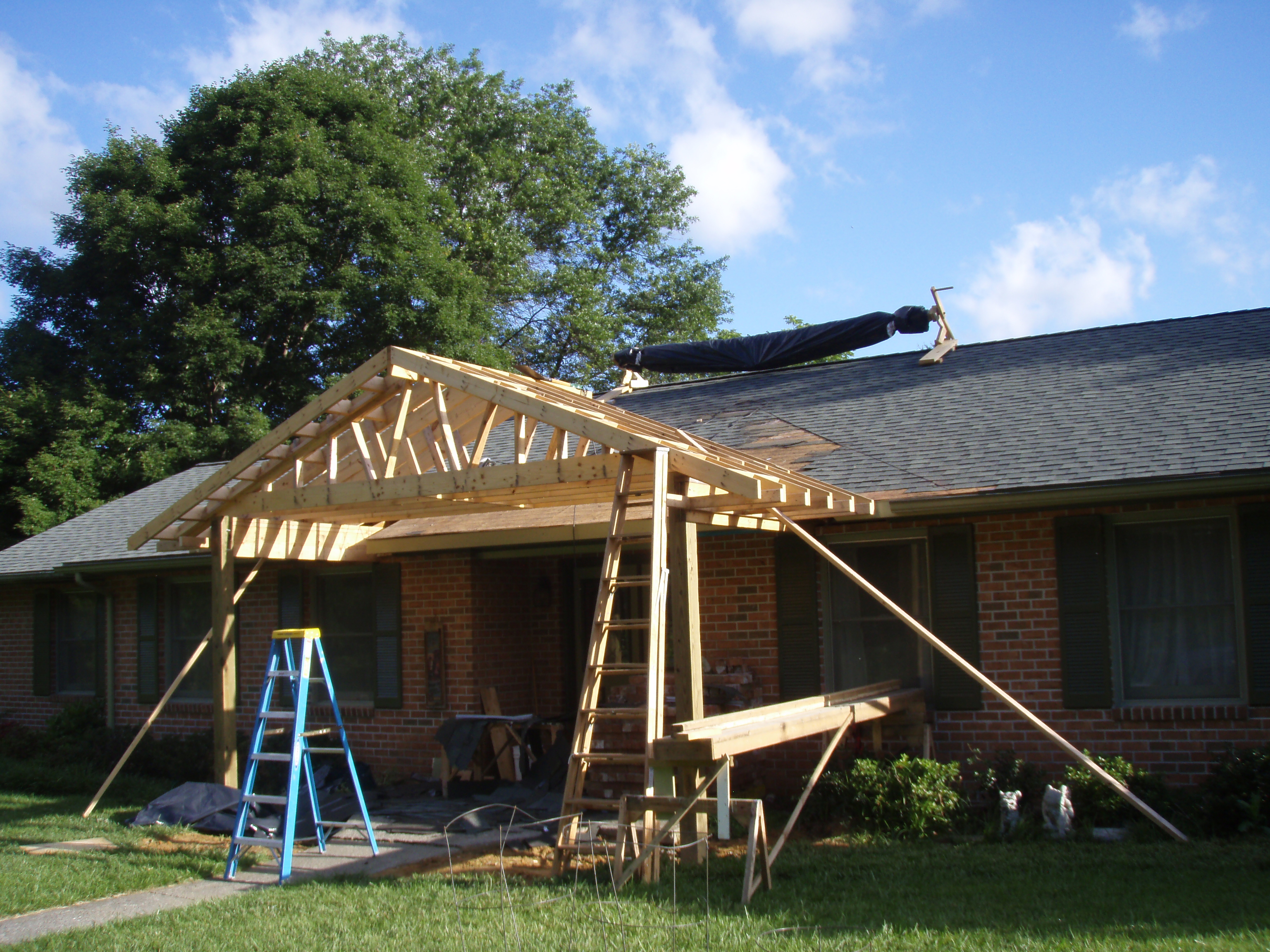 front gable porch with brick raised garden