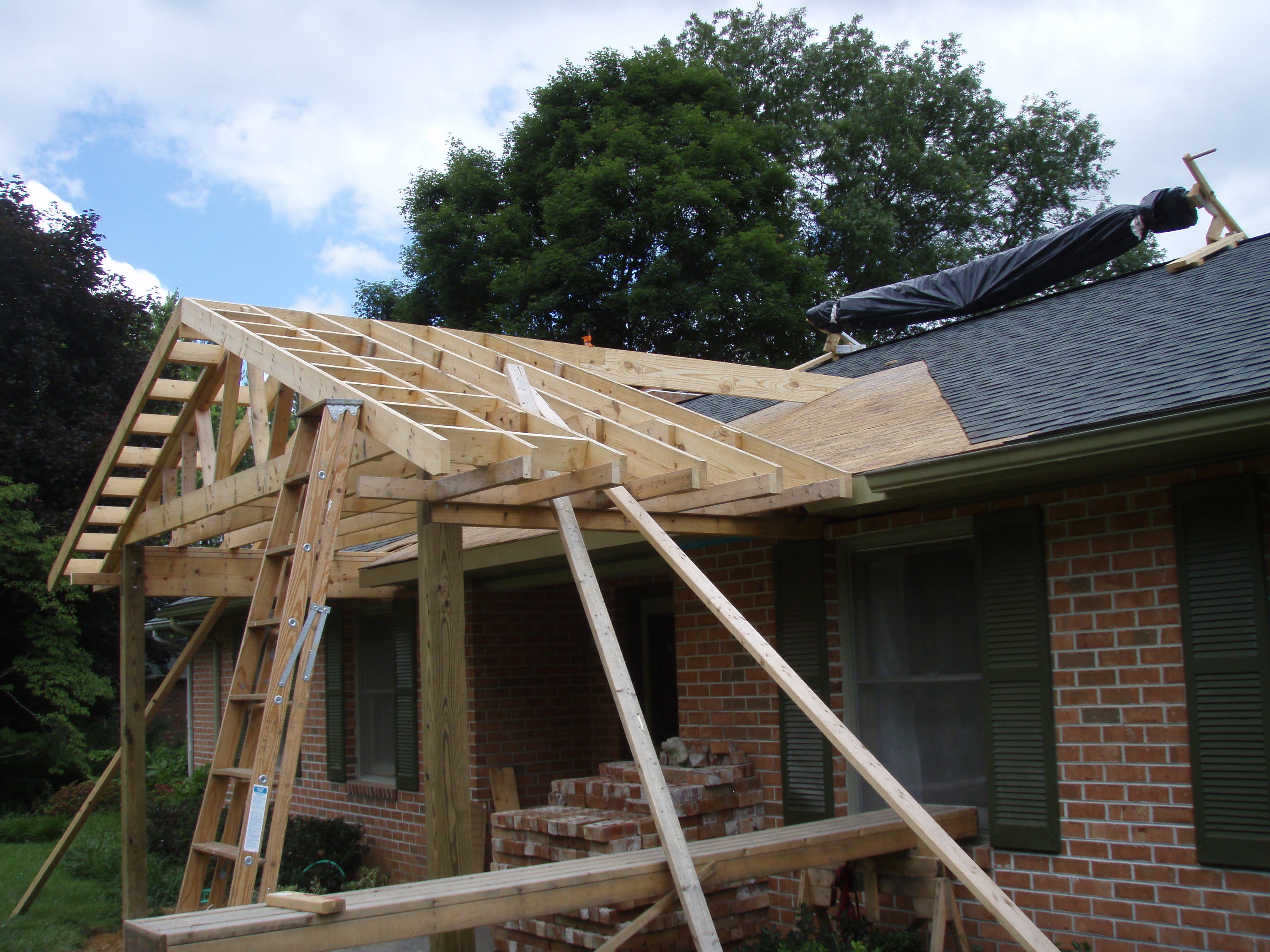 front gable porch with brick raised garden