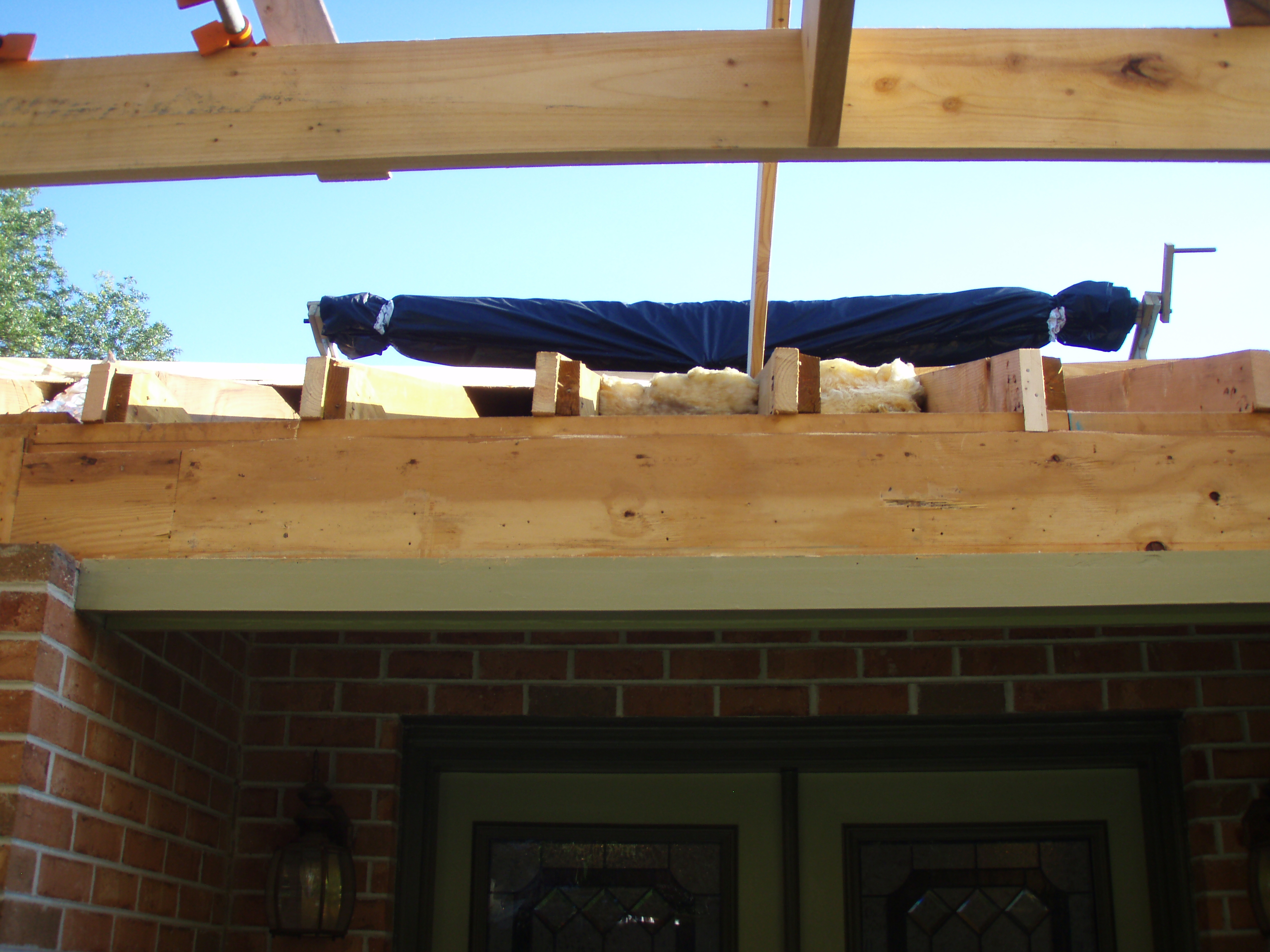 front gable porch with brick raised garden