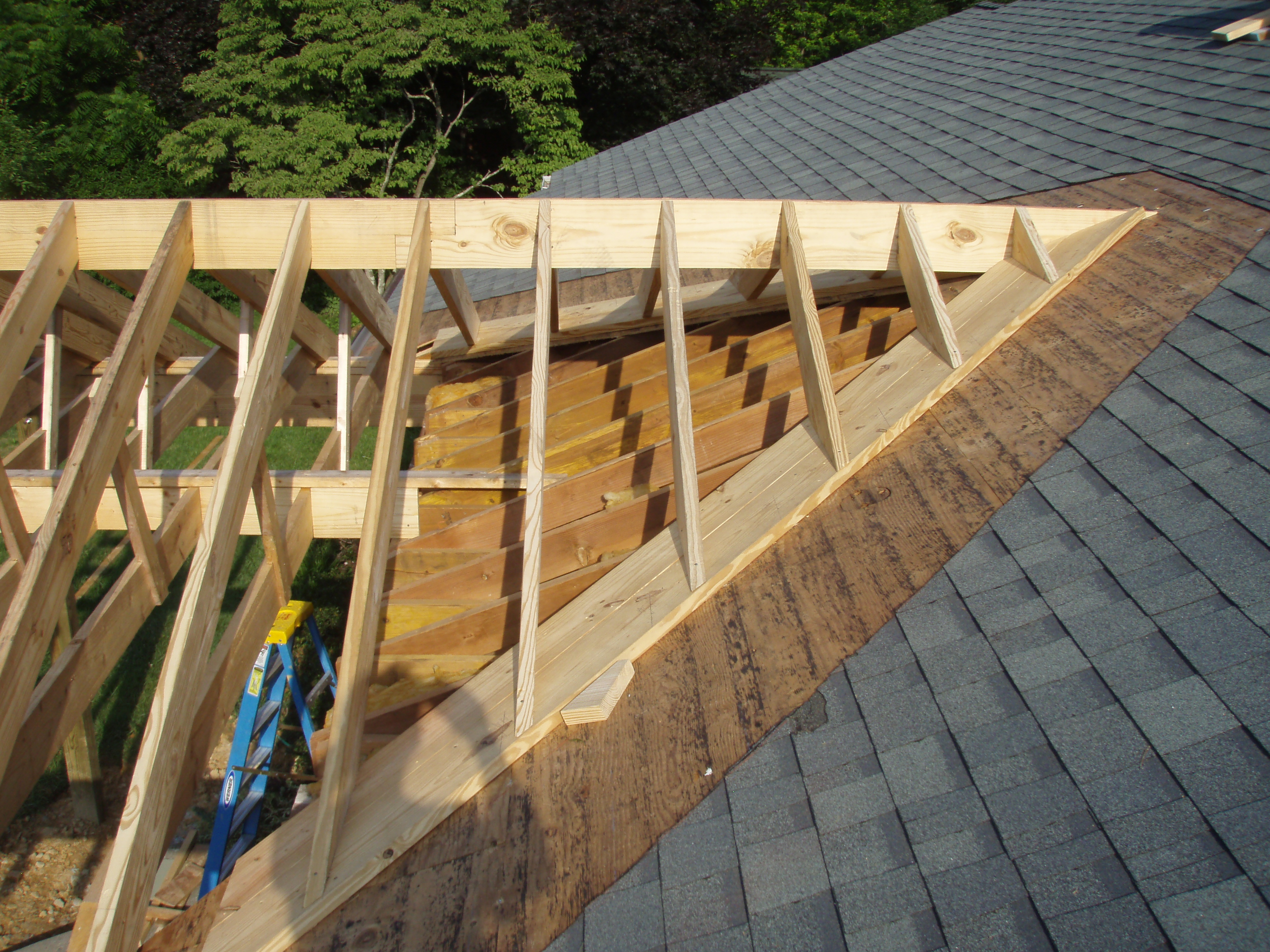 front gable porch with brick raised garden