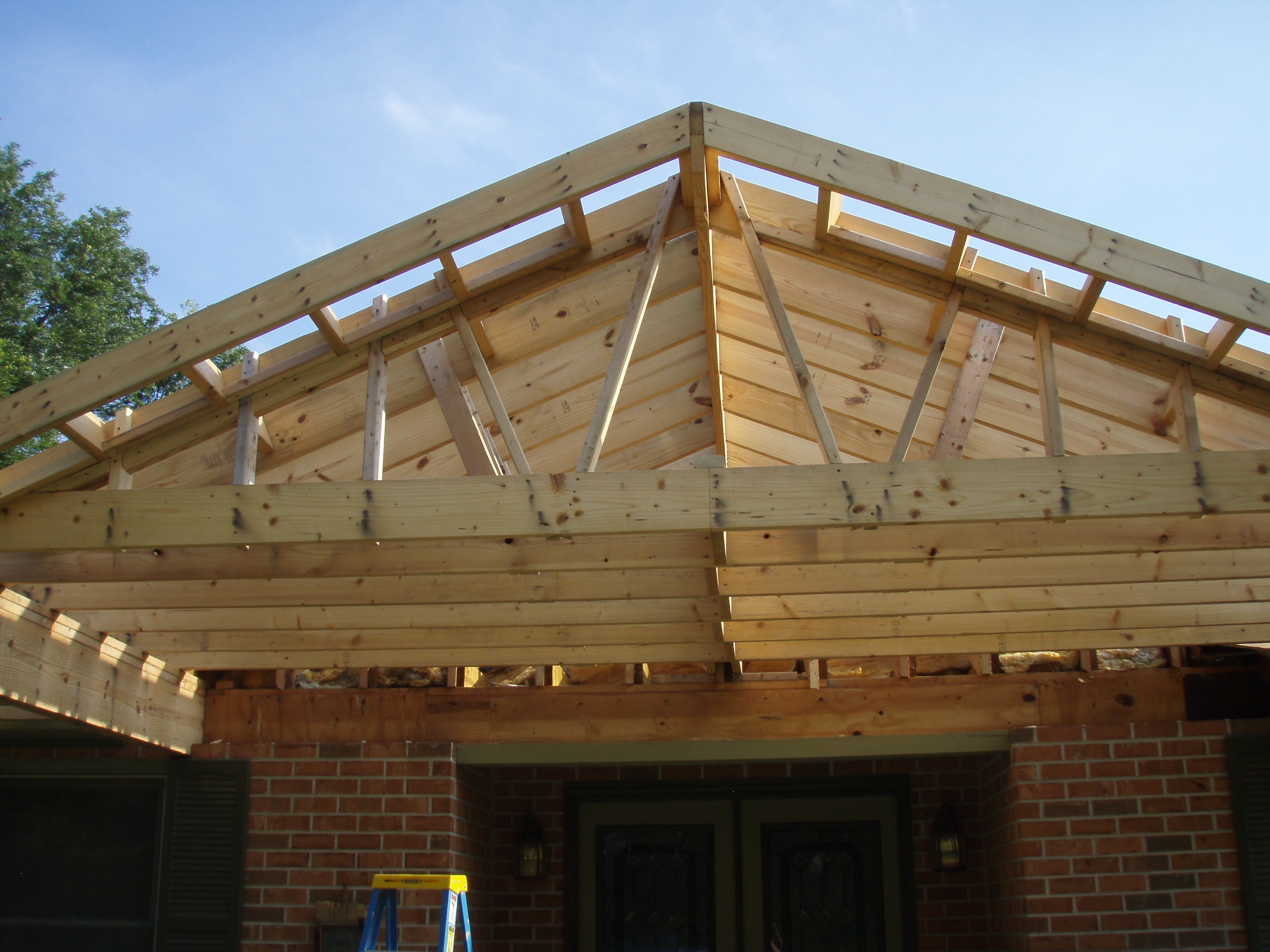 front gable porch with brick raised garden