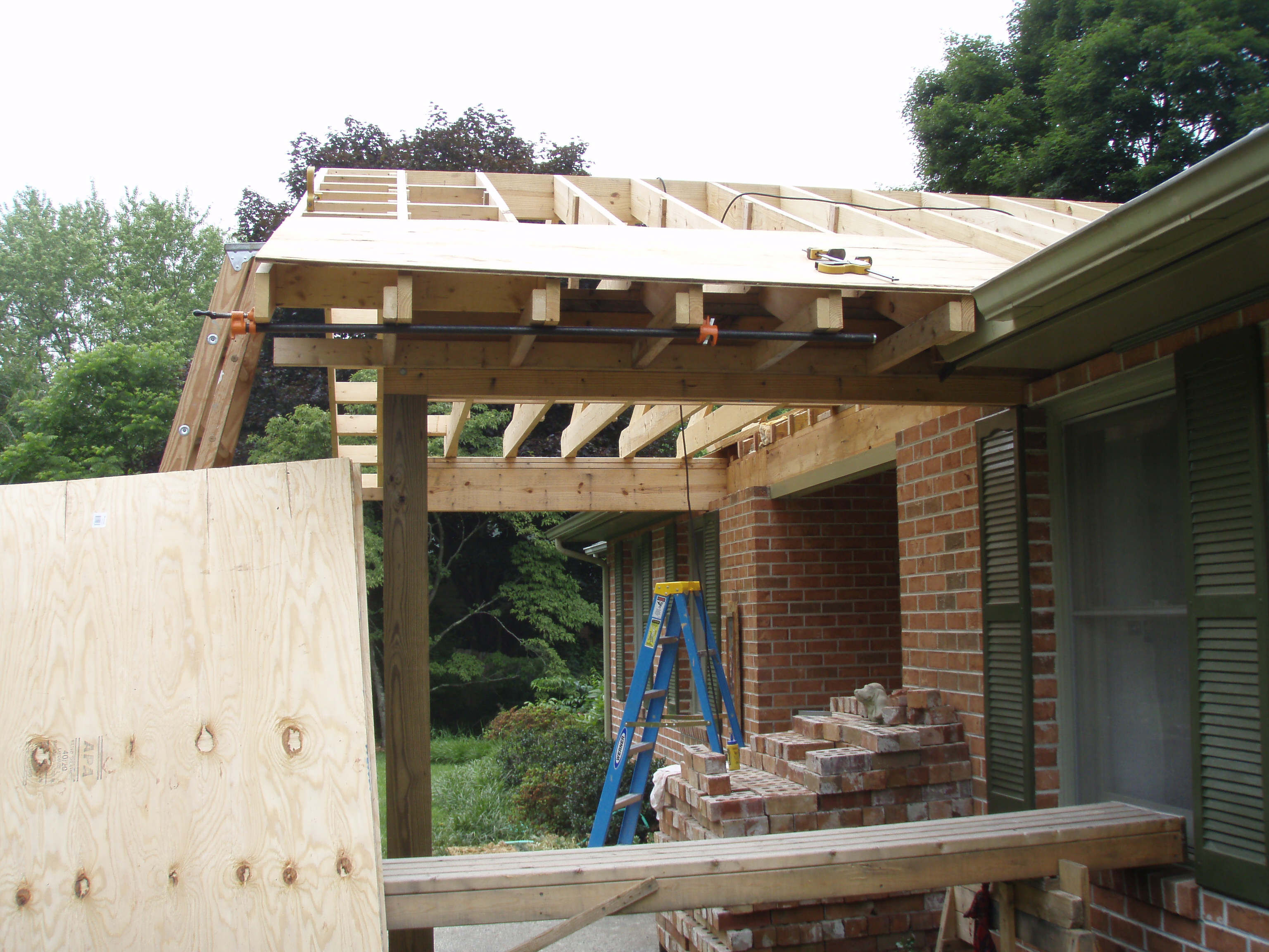 front gable porch with brick raised garden