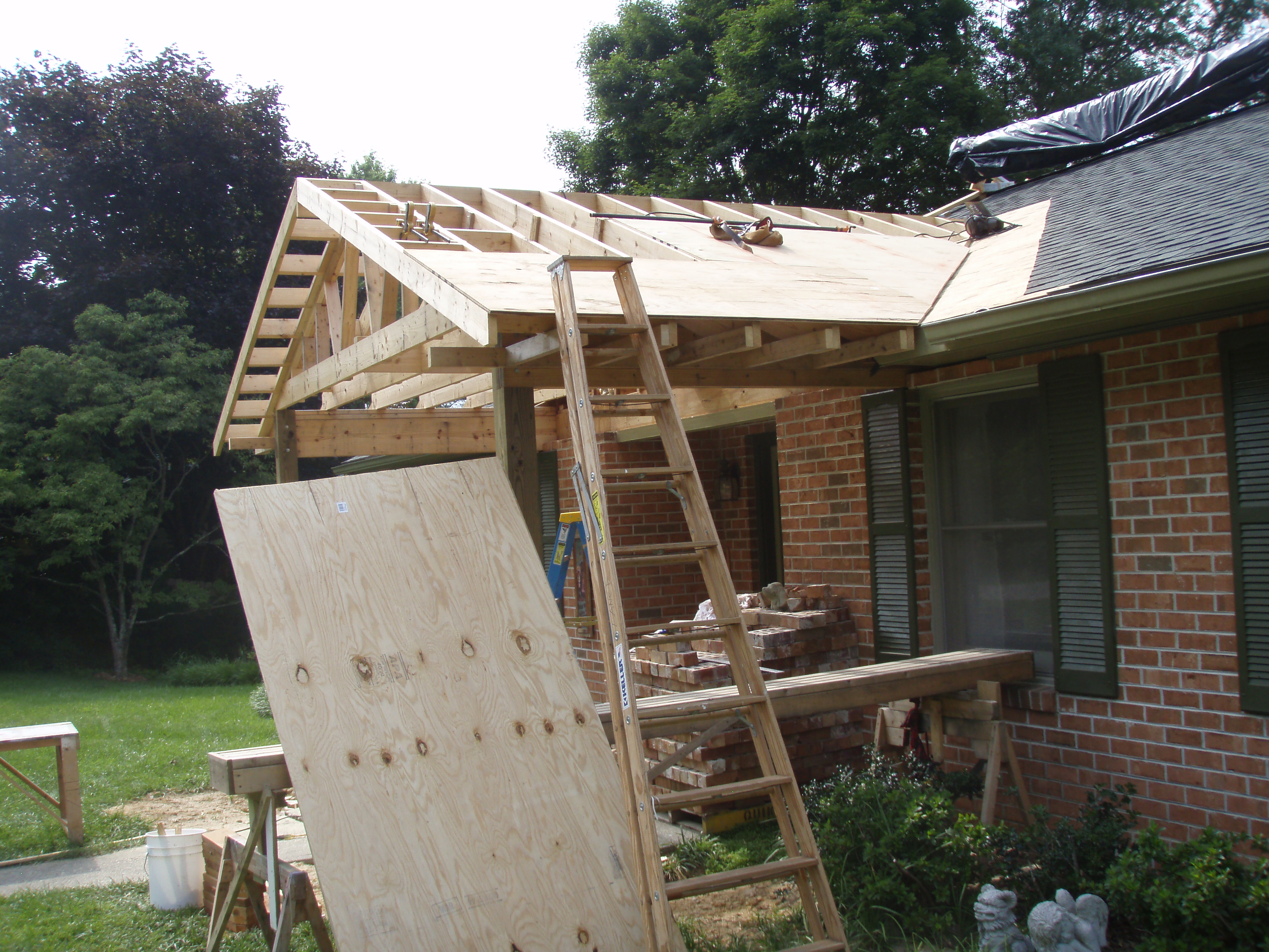 front gable porch with brick raised garden